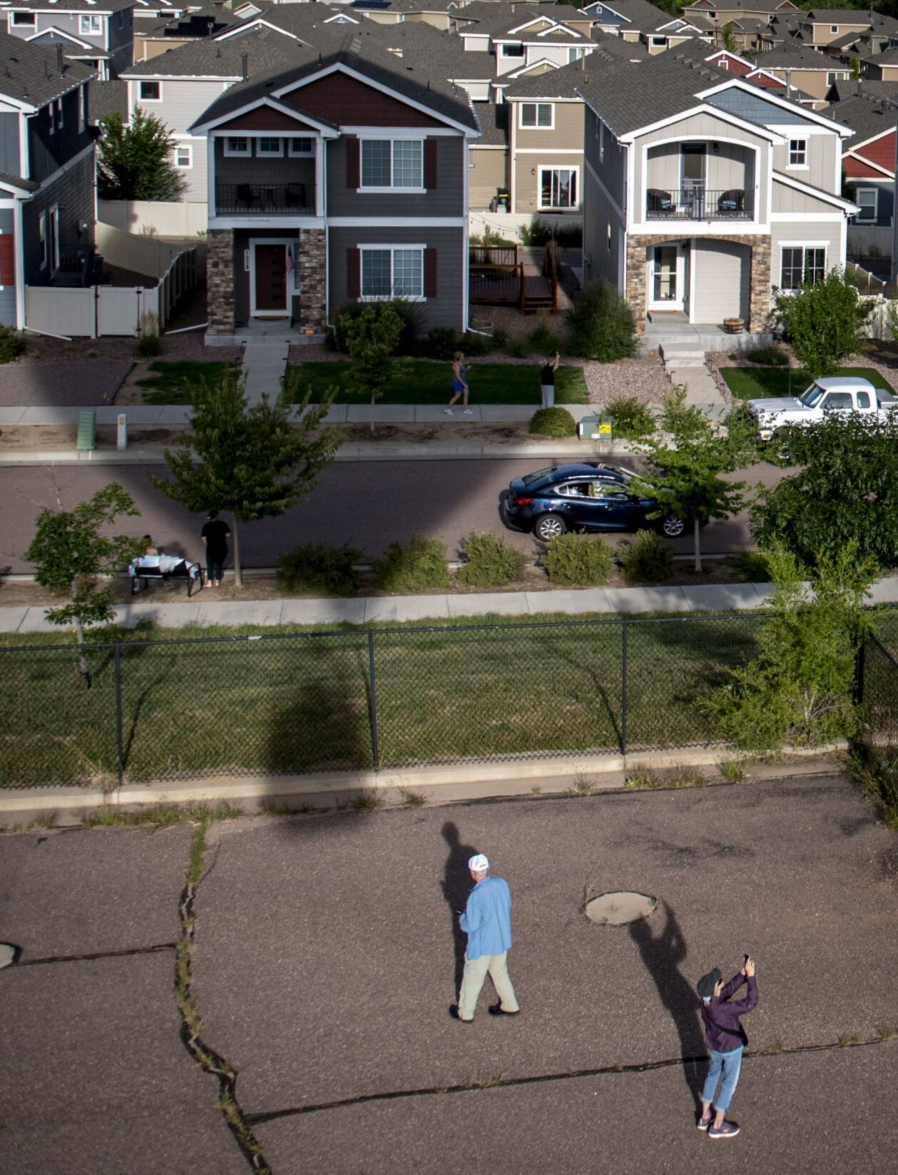People take to the neighborhood streets to get a glimpse of the balloons soaring overhead from Memorial Park for the Labor Day Lift Off in Colorado Springs on Saturday, September 2, 2023. (Gabi Broekema, The Gazette) (Gabi Broekema)