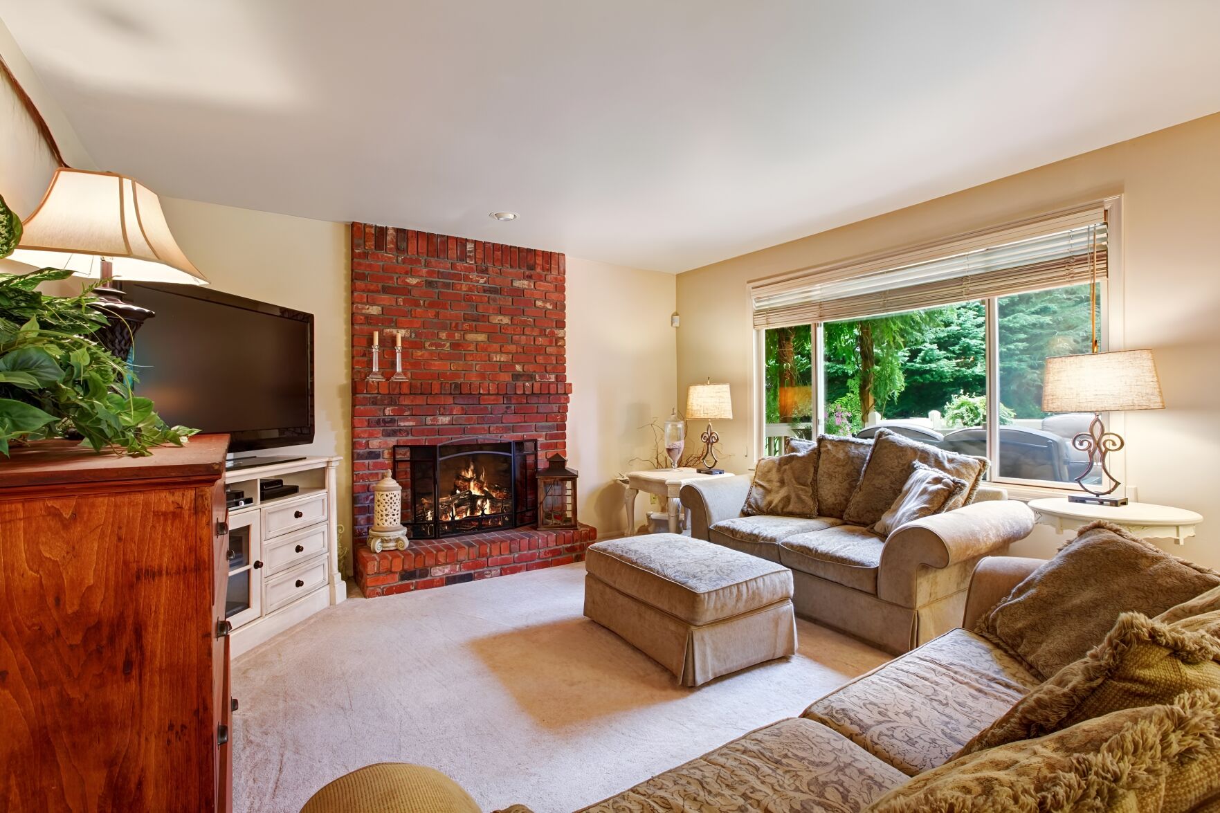 Have trouble visualizing? New AI technology from REimagine Home by Stylerod lets you upload a photo like this living room, left, and virtually remodel it, as the image below shows. For a small fee (10 photo downloads cost $19), prospective homebuyers or homeowners can instantly envision what a home could be. (photos Courtesy of REimagineHome.ai)