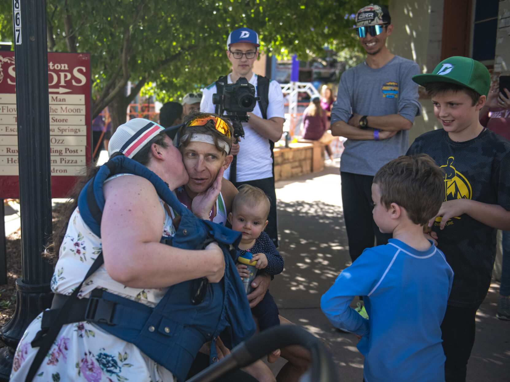 Pikes Peak Marathon 2023 runner-up Seth DeMoor rests for barely a minute before meeting with his wife Brigid DeMoor and 6 children after finishing the Pikes Peak Marathon in Manitou Springs on Sunday, September 17, 2023. (Gabi Broekema)