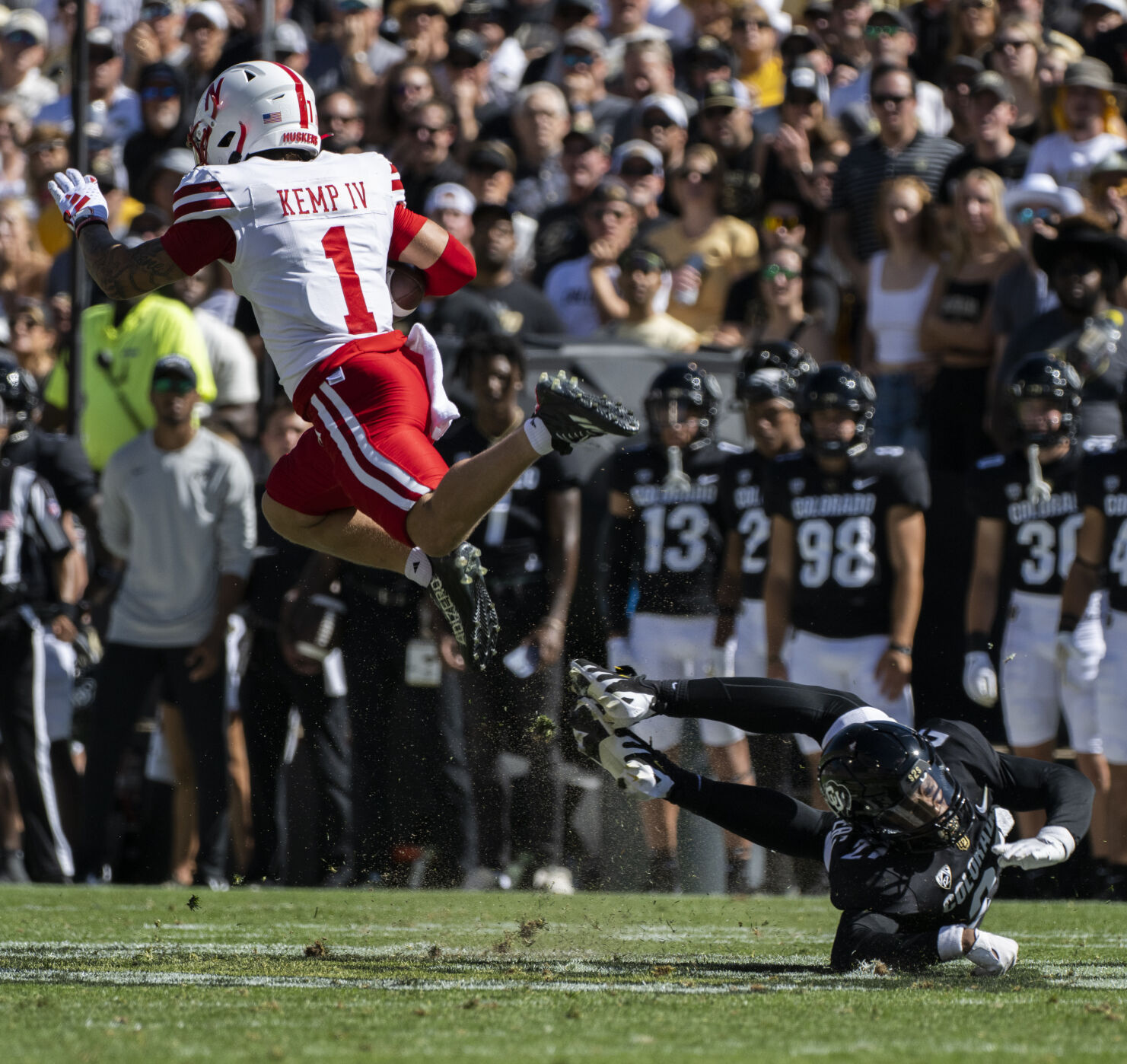 Nebraska Cornhuskers wide receiver Billy Kemp IV (1) leaps over the tackle of Colorado Buffaloes safety Shilo Sanders (21) during the first half Saturday, Sept. 9, 2023, at Folsom Field in Boulder, Colo. (The Gazette, Christian Murdock) (Christian Murdock/The Gazette)