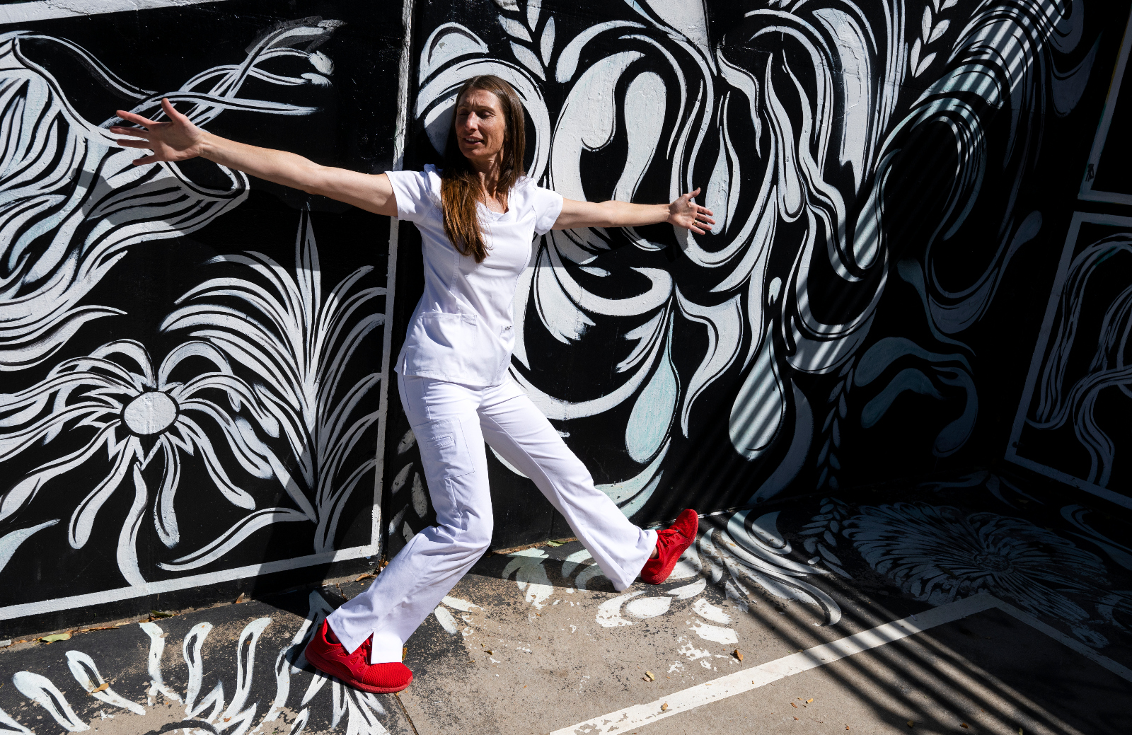 Tara Rynders, photographed at Sunken Gardens Park in September 2023, has been using her dance background to help her fellow nurses since 2009. (Christian Murdock, The Denver Gazette)