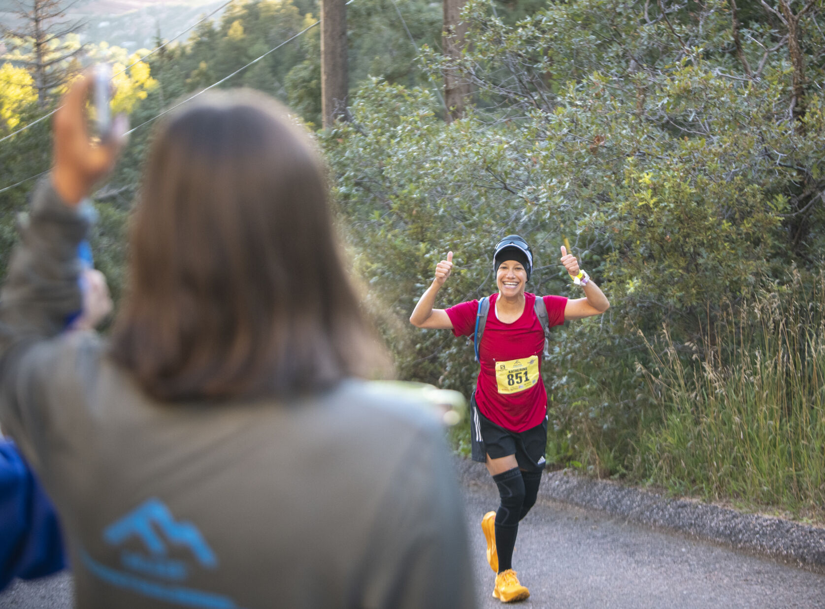 Pikes Peak Marathon runner Katherine Ruth Wadsworth smiles on the first leg of the marathon in Manitou Springs on Sunday, September 17, 2023. (Gabi Broekema)