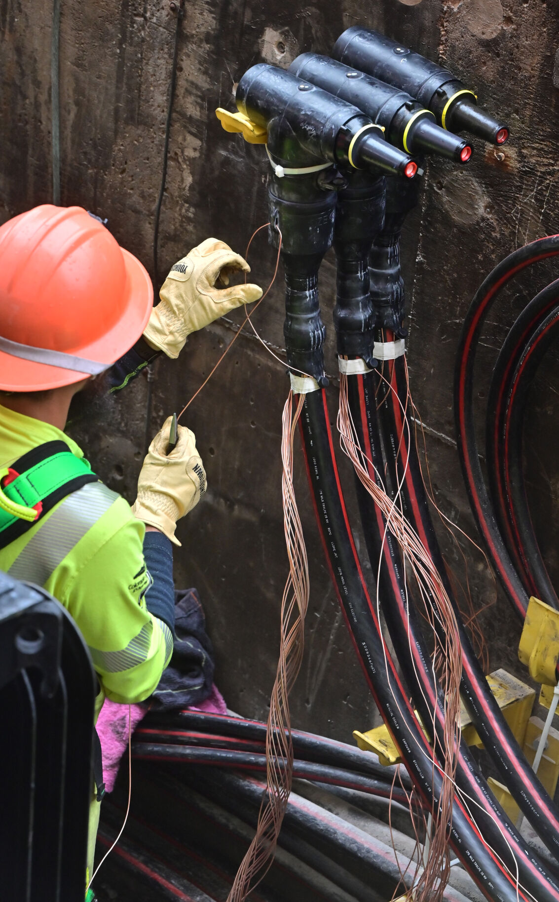 Crews from Colorado Springs Utilities replace wiring in a vault this week that’s usually under the streets on Kiowa Street. Crews worked on damage caused by an underground fire in downtown that ended up shutting down parts of Colorado Springs because of a loss of power. Power has been restored. (Jerilee Bennett, The Gazette)