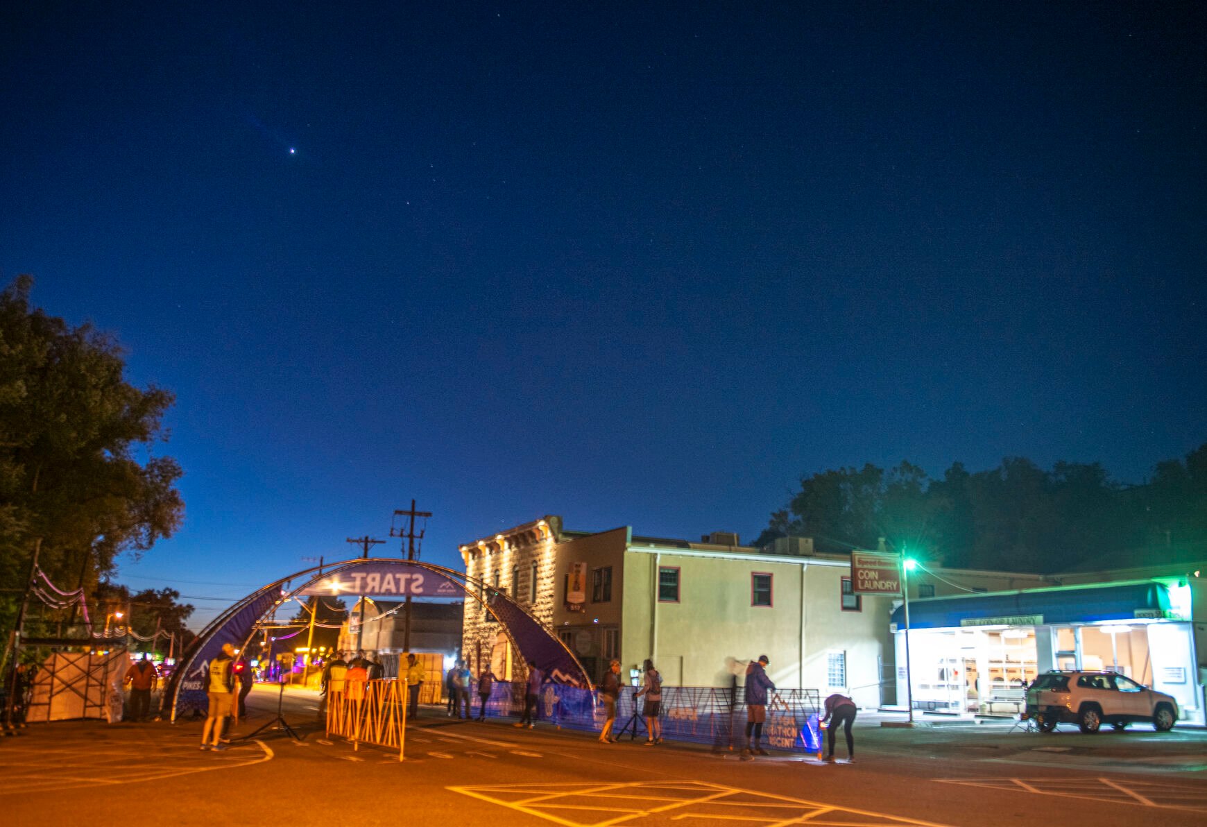 The Pikes Peak Marathon operations team works together to set up the starting line for the 68th running of the Pikes Peak Marathon in Manitou Springs on Sunday, September 17, 2023. (Gabi Broekema)