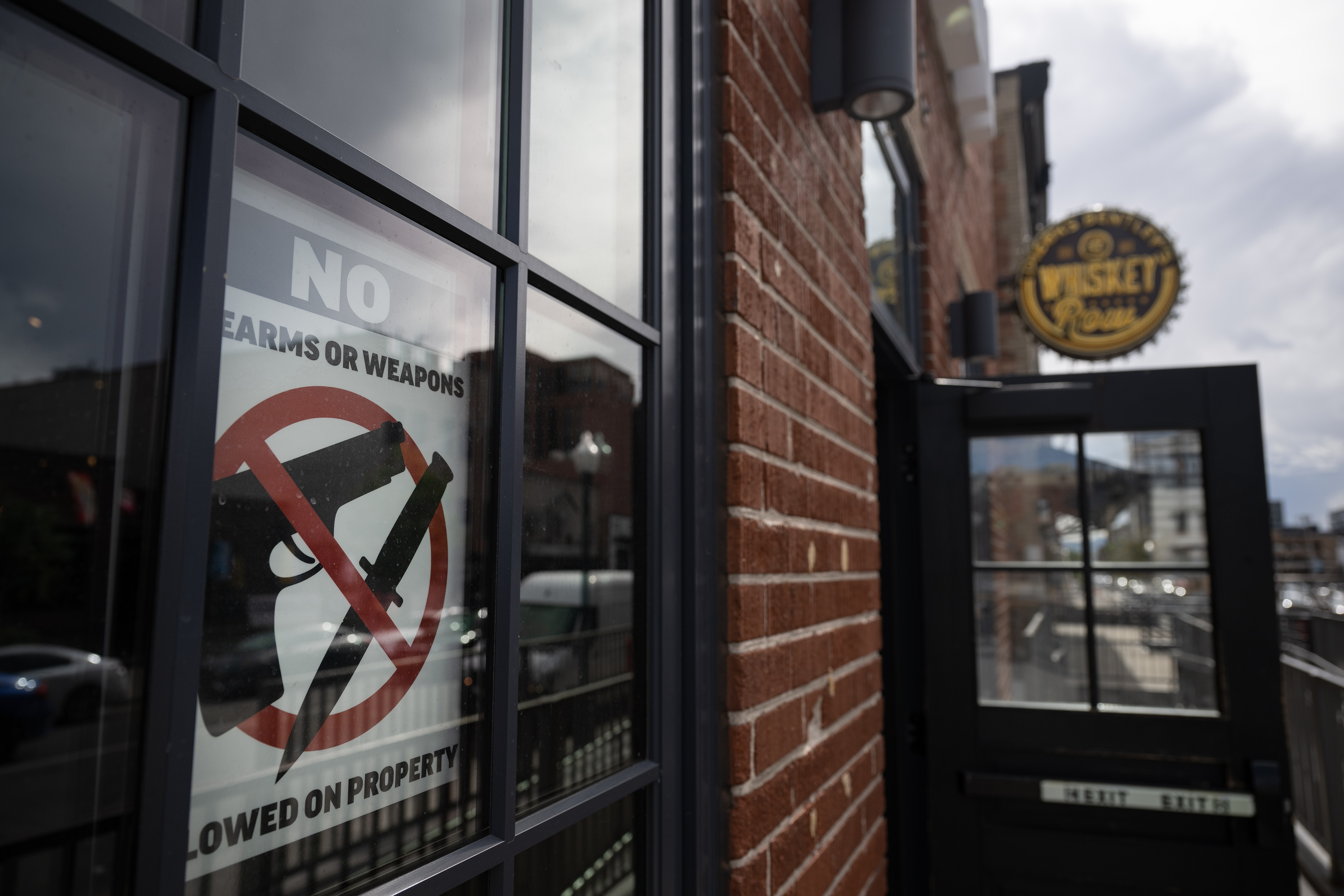 A sign prohibiting weapons hangs in one of the front windows of Dierks Bentley's Whiskey Row Denver near the intersection of Market Street and 20th Street, as seen on Wednesday, Sept. 20, 2023, in Denver, Colo. (Timothy Hurst/Denver Gazette) (TimHursttim.hurst@gazette.comhttps://secure.gravatar.com/avatar/aca82bd62b4ee425c598527cd6faa1b1?d=mm&r=g)