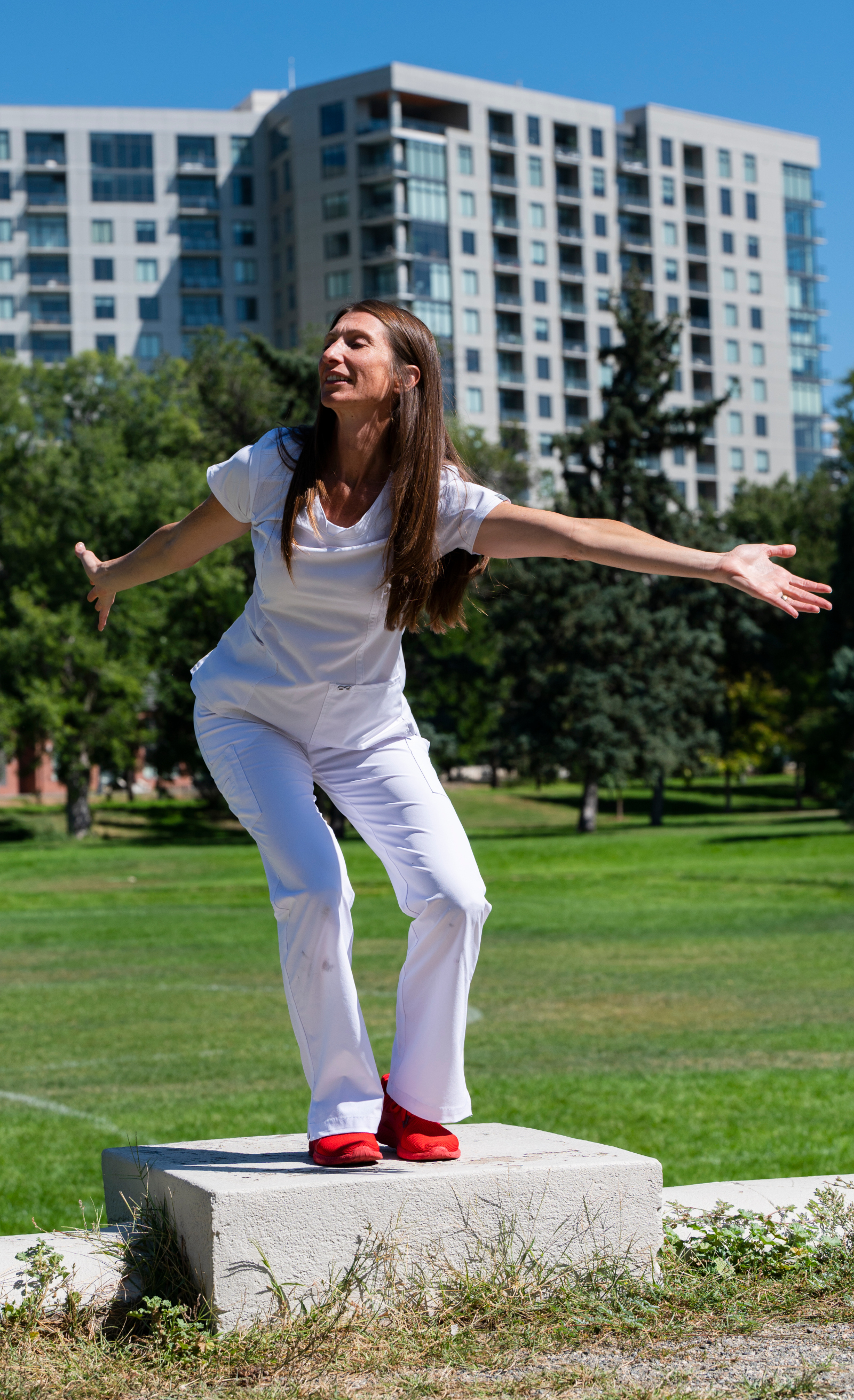 Tara Rynders, photographed at Sunken Gardens Park in September 2023, has been using her dance background to help her fellow nurses since 2009. (Christian Murdock, The Denver Gazette)