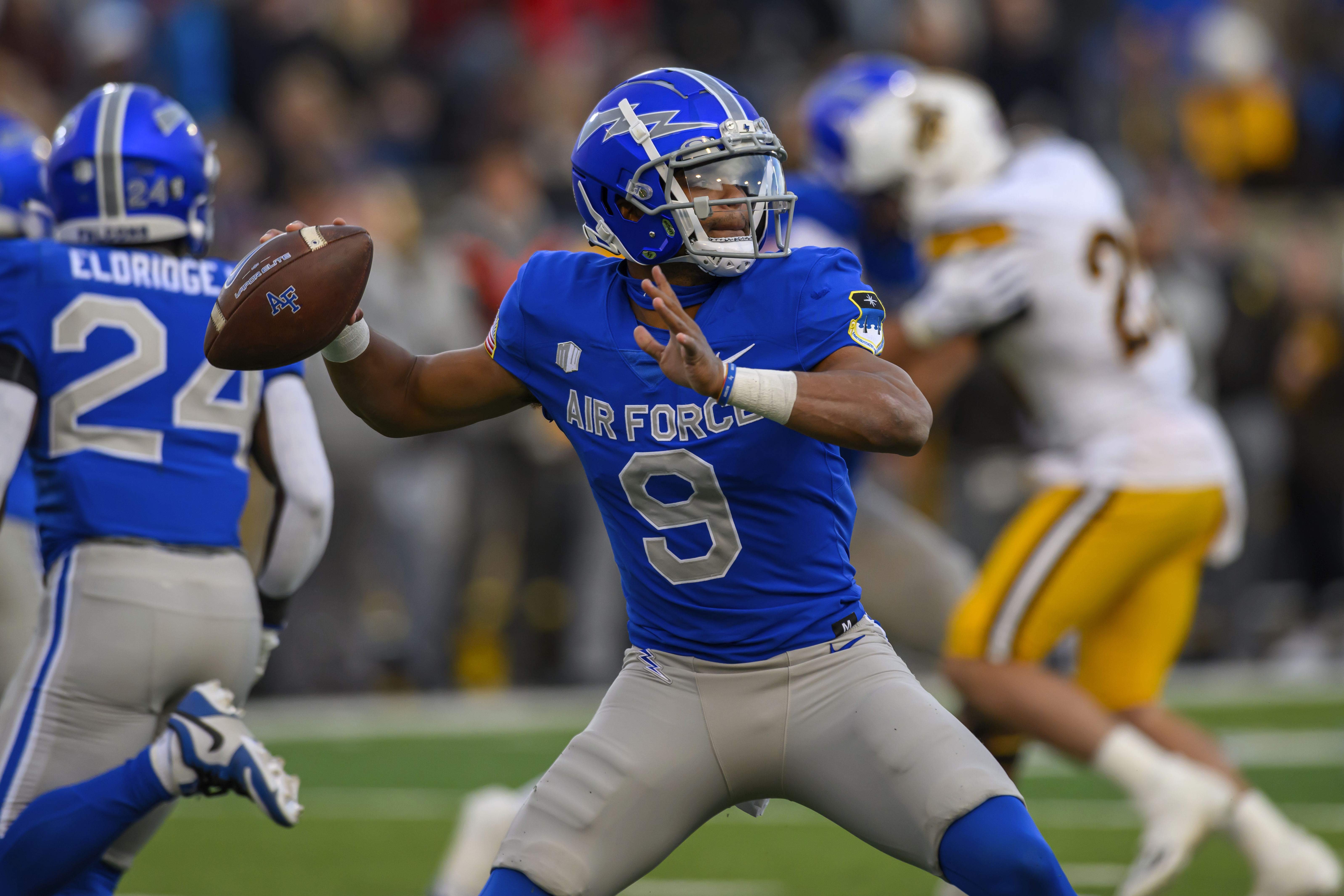 Air Force quarterback Zac Larrier (9) looks to pass during an NCAA football game on Saturday, Oct. 14, 2023 in Denver. (AP Photo/Tyler Tate) (Tyler Tate)
