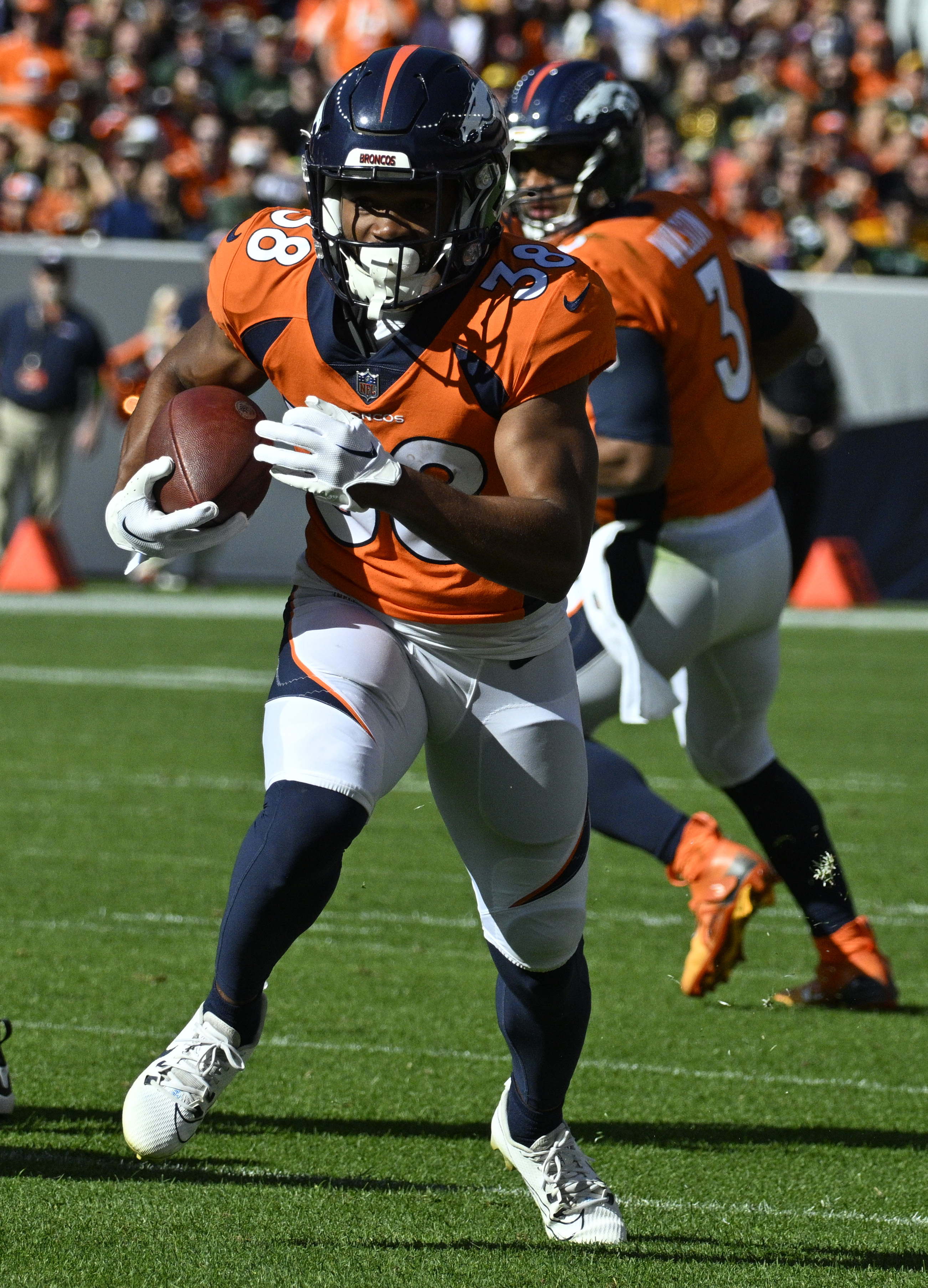 Denver Broncos running back Jaleel McLaughlin (38) carries the ball during a game at Empower Field at Mile High on Sunday, Oct. 22, 2023. (Photo by Jerilee Bennett, The Gazette)