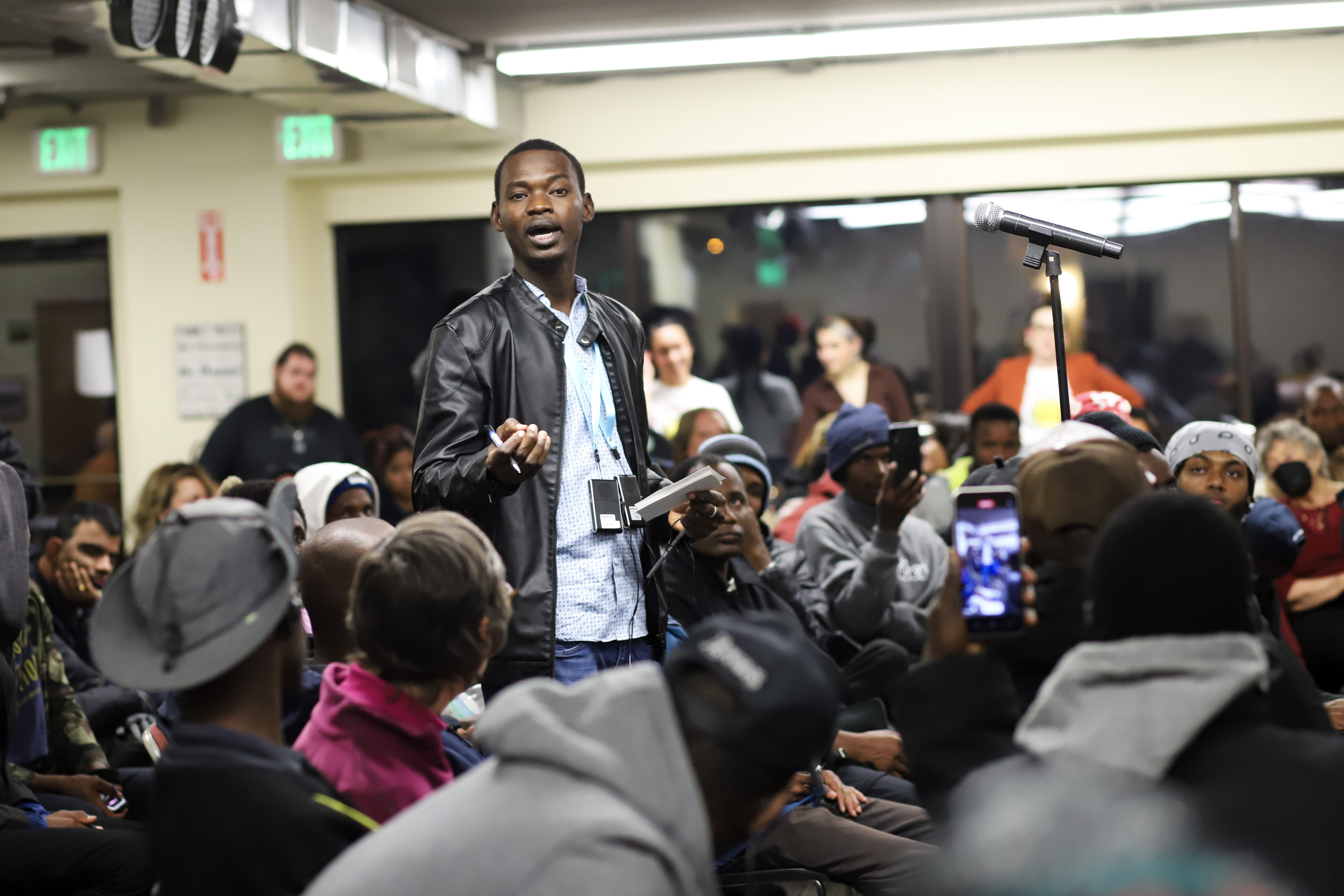 An Aurora resident asks candidates a question while people wearing translation headsets listen during a multilingual candidate forum in Aurora Thursday. (KylaPearceAurora reporterkyla.pearce@denvergazette.comhttps://denvergazette.com/content/tncms/avatars/2/16/1e5/2161e54a-3f47-11ed-bc0c-ff41892600ae.4fb8f678b9b96eab286c33c5af828fe7.png)