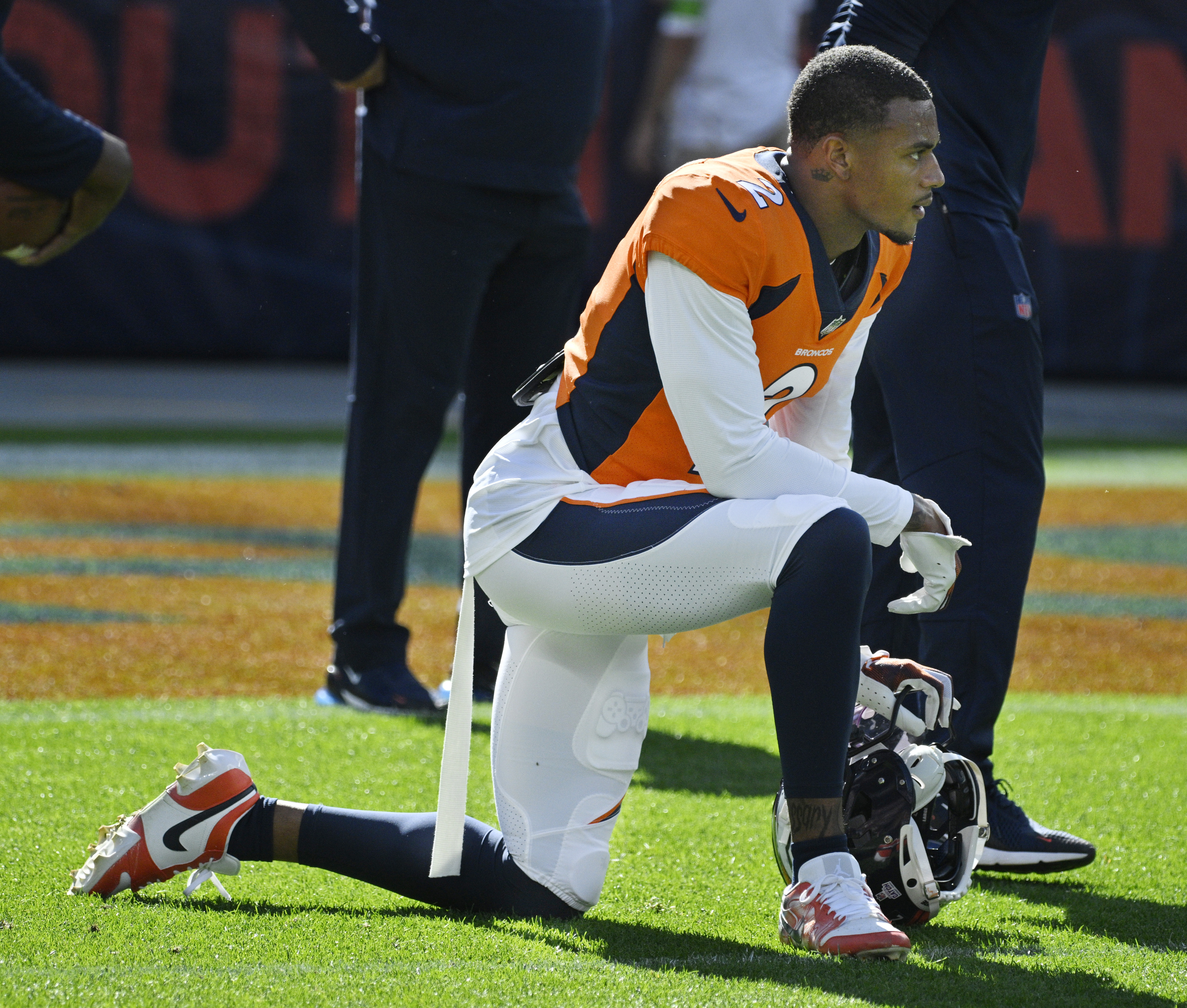 Denver Broncos cornerback Pat Surtain II (2) takes a knee during warmups before a game against the Packers on Sunday, Oct. 22, 2023. (Photo by Jerilee