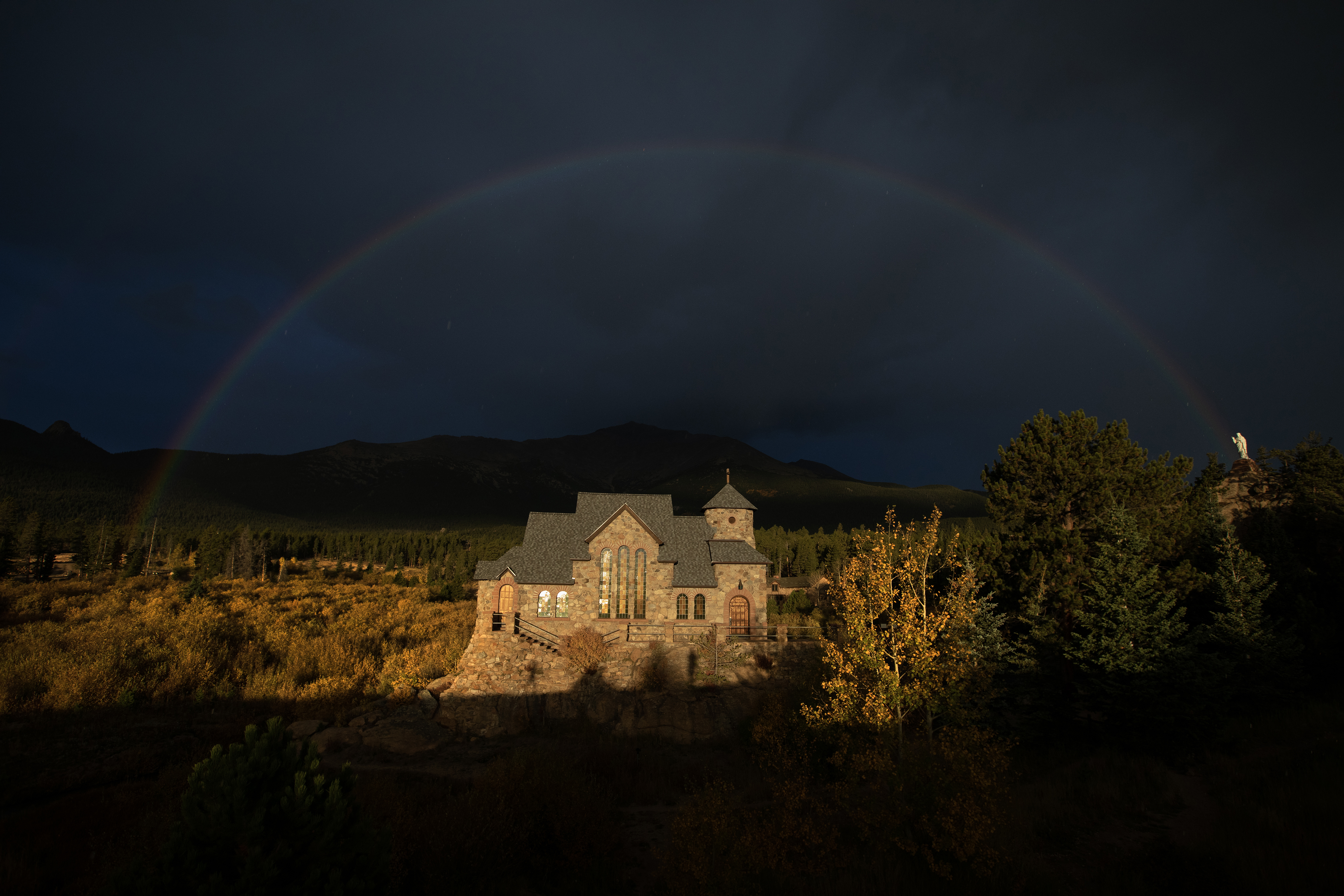A rainbow arches over Saint Catherine's Chapel on the Rock as the church is illuminated by the early morning sun on Monday, Oct. 2, 2023, in Allenspark, Colo. (Timothy Hurst/Denver Gazette) (TimHursttim.hurst@gazette.comhttps://secure.gravatar.com/avatar/aca82bd62b4ee425c598527cd6faa1b1?d=mm&r=g)