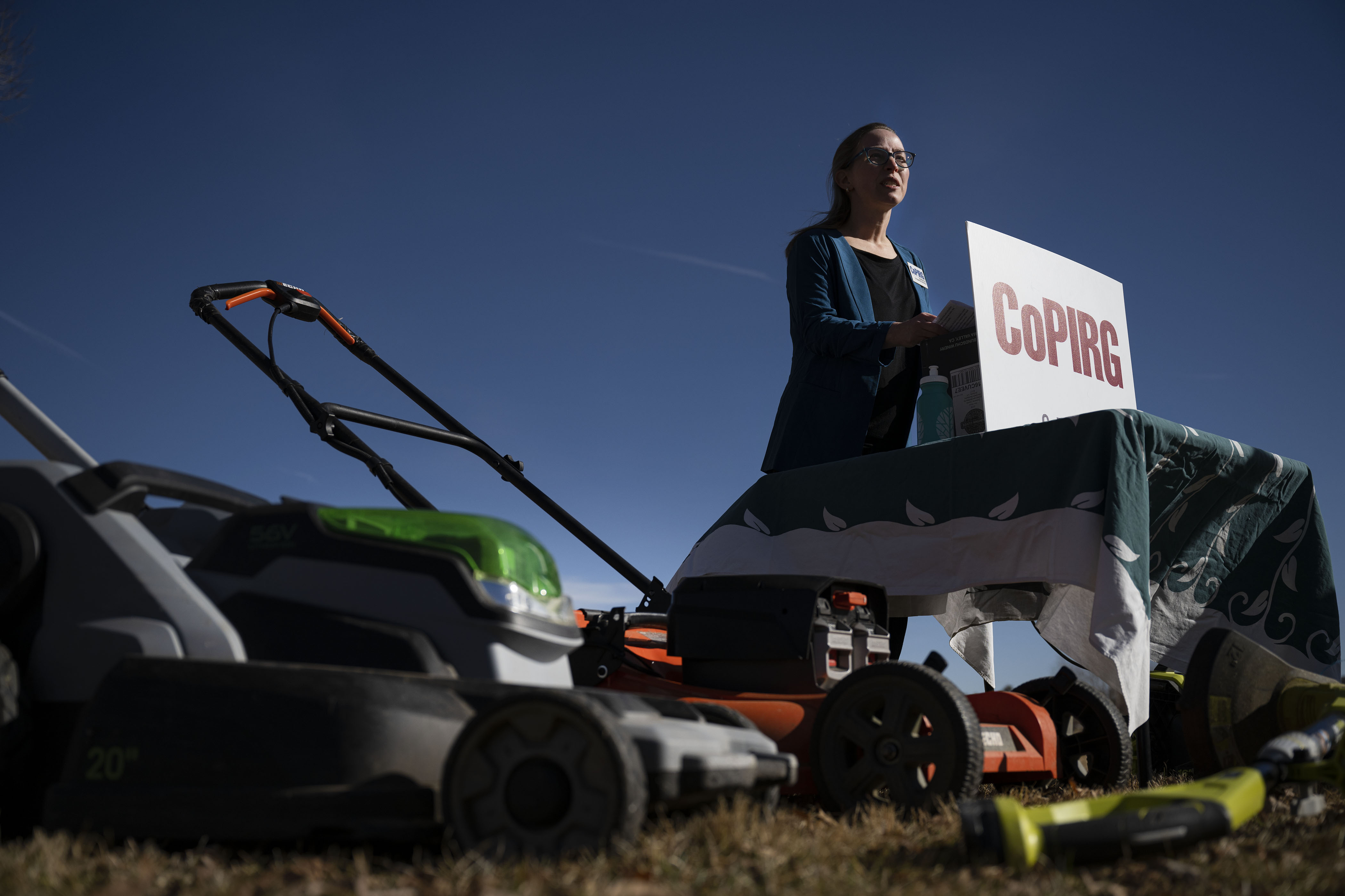 Kirsten Schatz, with the Colorado Public Interest Research Group, speaks to media members about a recently released report on ozone-causing pollutants from gas powered lawn and garden equipment while standing behind a display of electric garden equipment on Thursday, Dec. 1, 2022, at Sloan’s Lake Park in Denver, Colo. (Timothy Hurst/The Gazette) (TimHursttim.hurst@gazette.comhttps://secure.gravatar.com/avatar/aca82bd62b4ee425c598527cd6faa1b1?d=mm&r=g)