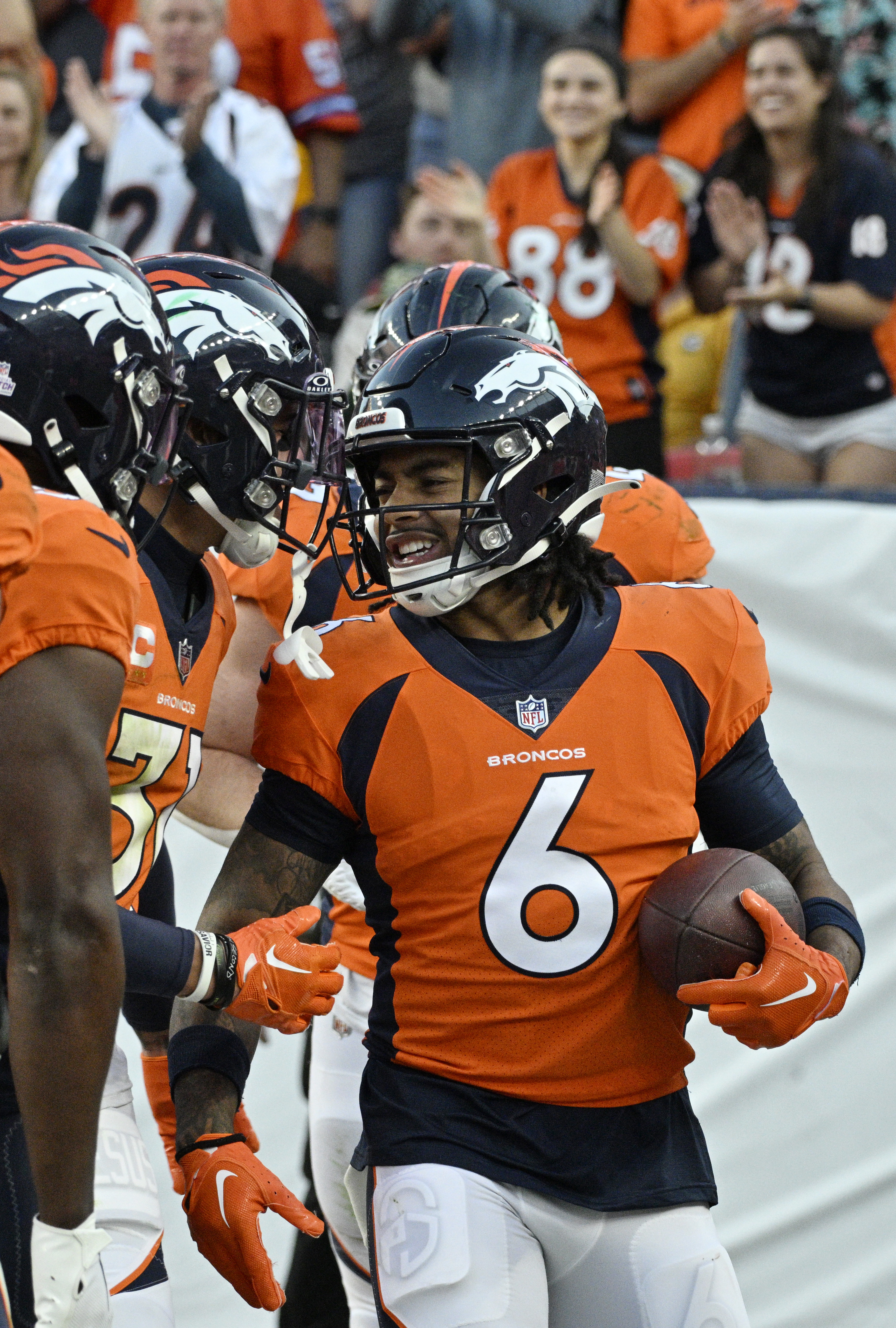 Broncos safety PJ Locke III celebrates with teammates after making the game winning interception in the 4th quarter of a game at Empower Field at Mile High on Sunday, Oct. 22, 2023. (Photo by Jerilee Bennett, The Gazette)