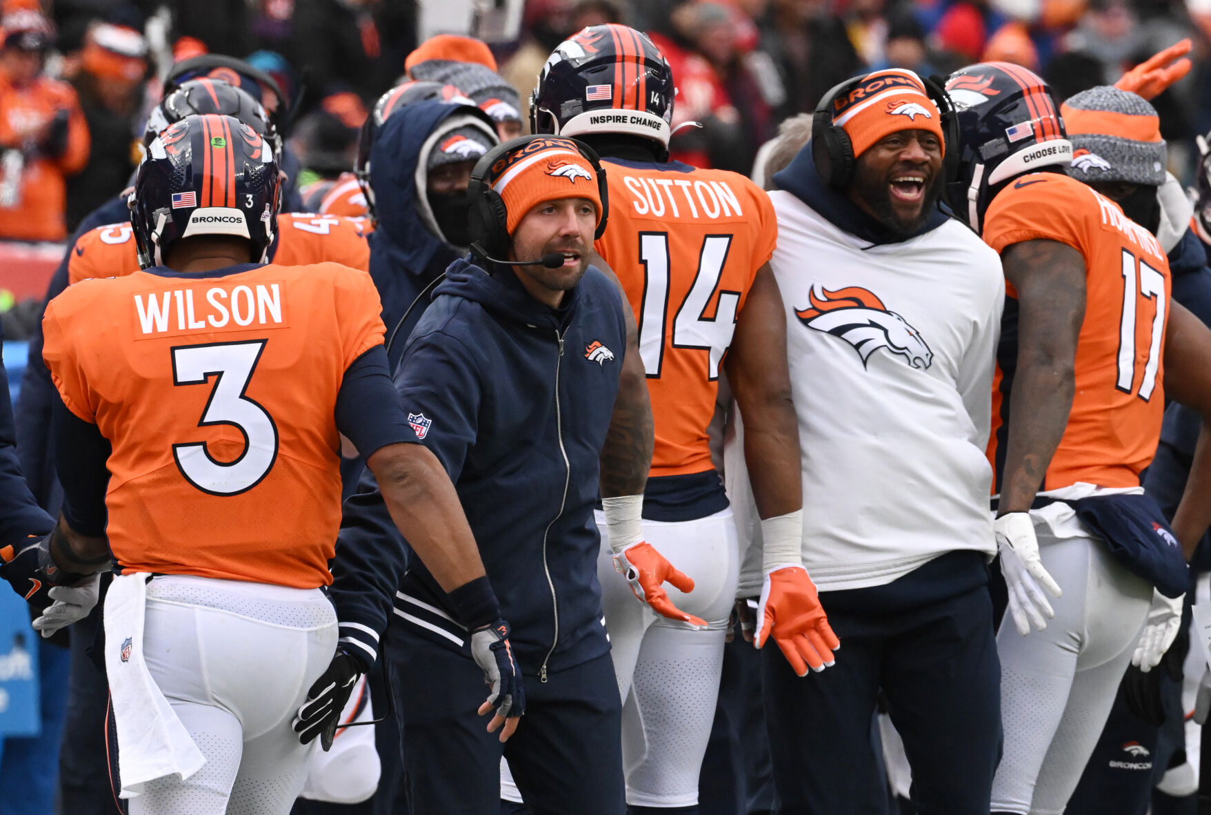 Coaches greet the offense after a touchdown during a game at Empower Field at Mile High on Sunday, Oct. 29, 2023. The Broncos won the game 24-9. (Photo by Jerilee Bennett, The Gazette)