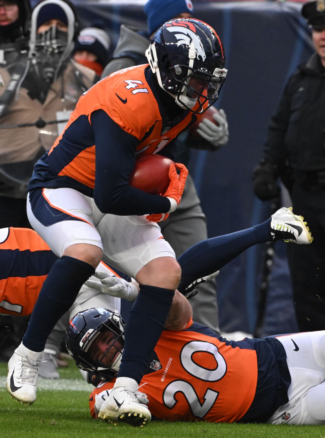 Denver Broncos linebacker Drew Sanders (41) scoops up a muffed punt fumble by the Chiefs in the 4th quarter of a game at Empower Field at Mile High on Sunday, Oct. 29, 2023. (Photo by Jerilee Bennett, The Gazette)