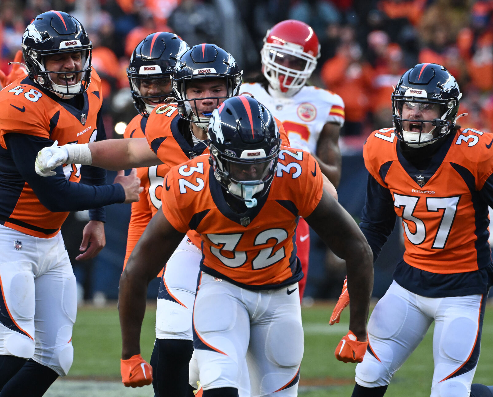 Denver Broncos safety Delarrin Turner-Yell (32) celebrates a play with his teammates during a game at Empower Field at Mile High on Sunday, Oct. 30, 2023. The Broncos defeated the Chiefs 24-9. (Photo by Jerilee Bennett, The Gazette)