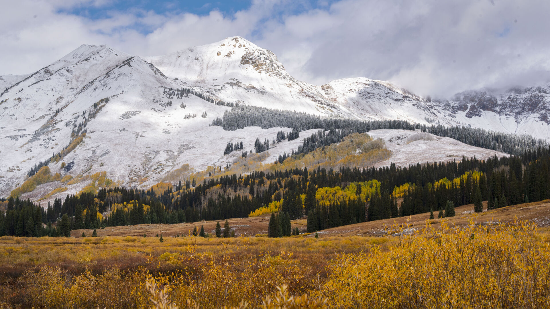 An overnight snowstorm dusts the Elk Mountains outside Gothic, Colo., as the aspens turn Tuesday, Oct. 3, 2023. (The Gazette, Christian Murdock) (Christian Murdock/The Gazette)