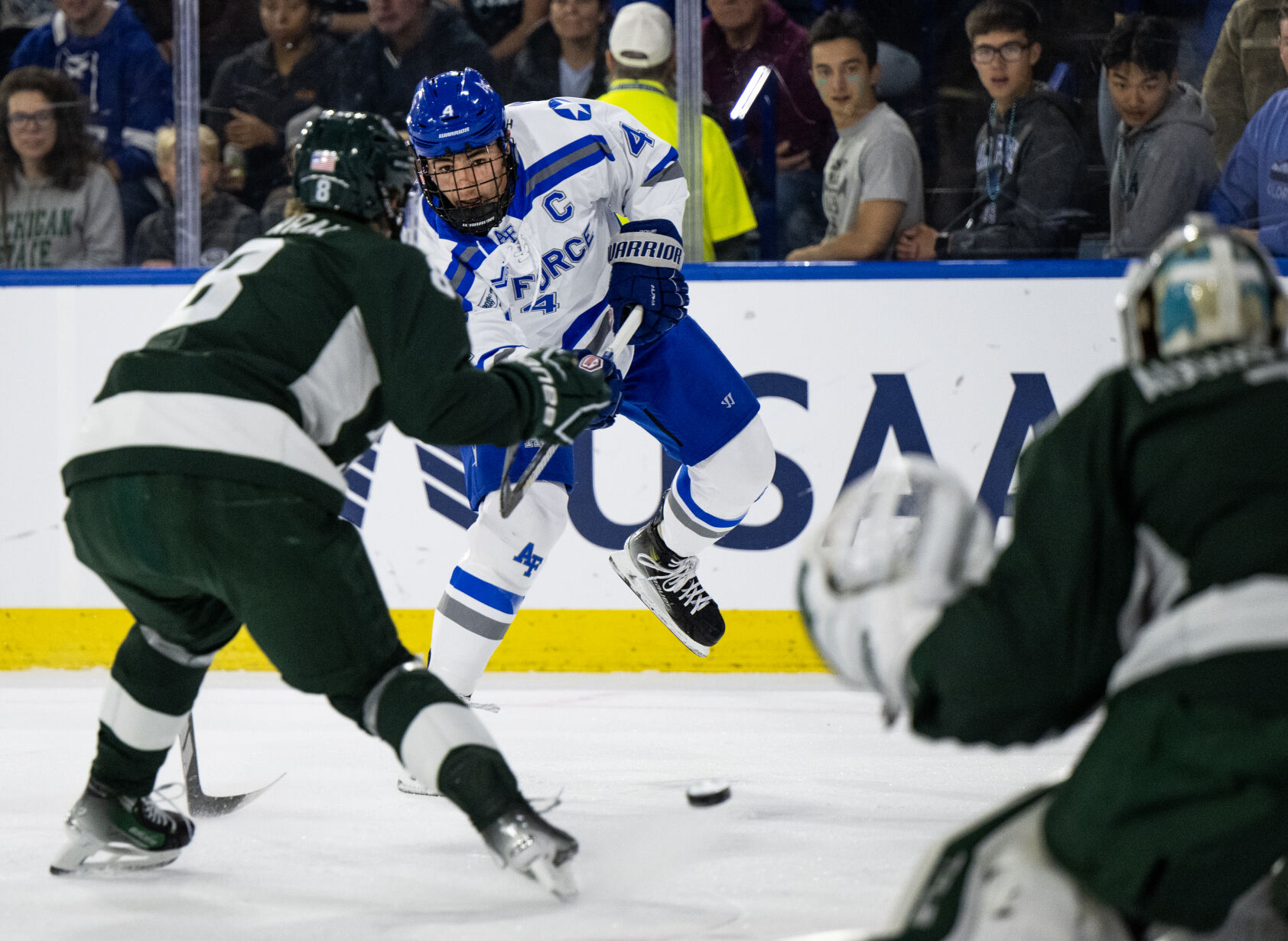 Air Force defenseman Luke Rowe (4) takes a shot in the first period of a game against Michigan State Thursday, Oct. 12, 2023, at the Cadet Ice Arena on the Air Force Academy in Colorado Springs, Colo. (Parker Seibold, The Gazette) (Parker Seibold)