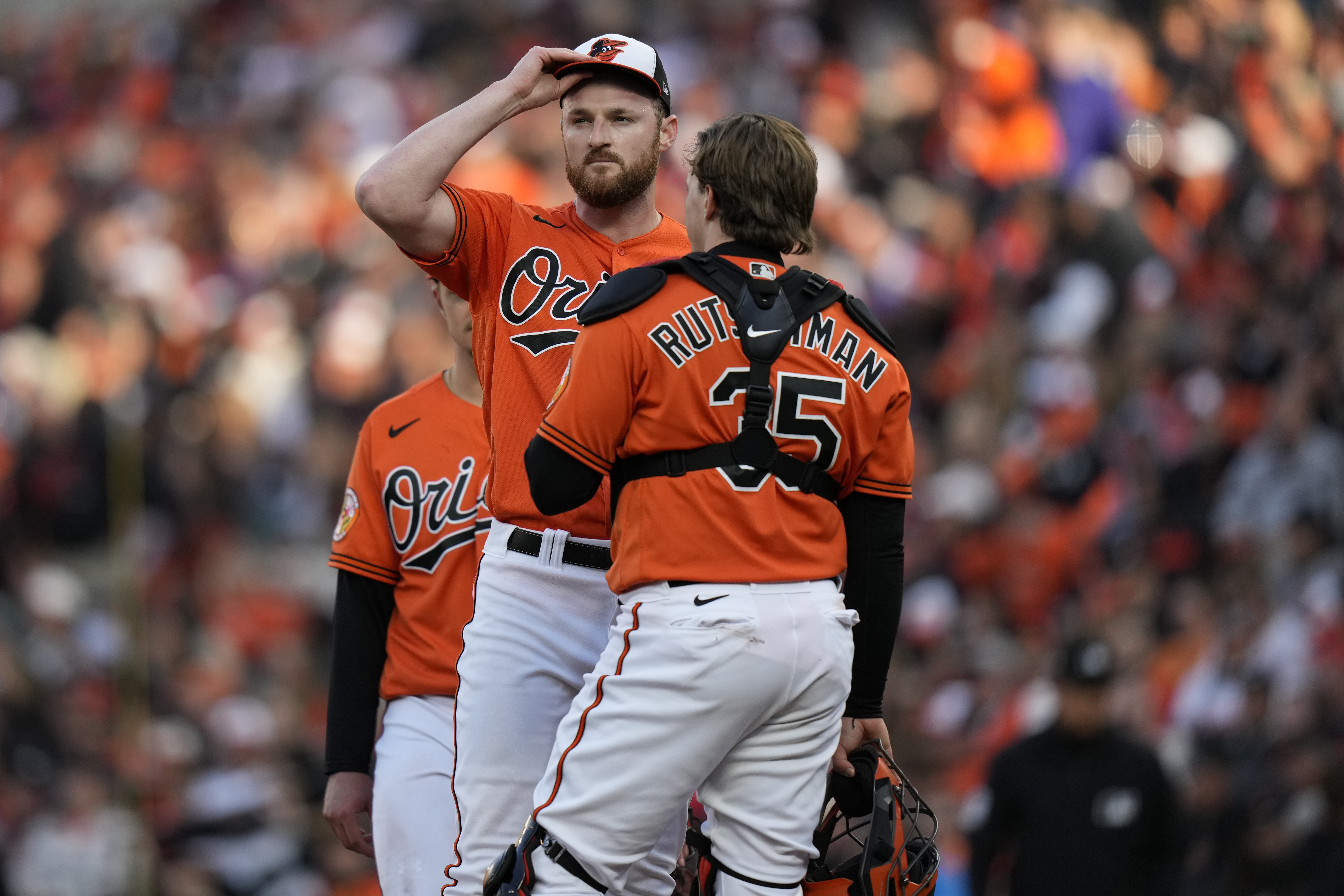 Baltimore Orioles relief pitcher Bryan Baker, center, reacts just before being pulled from the game during the third inning in Game 2 of an American League Division Series baseball game against the Texas Rangers, Sunday, Oct. 8, 2023, in Baltimore. (AP Photo/Alex Brandon) (Alex Brandon)
