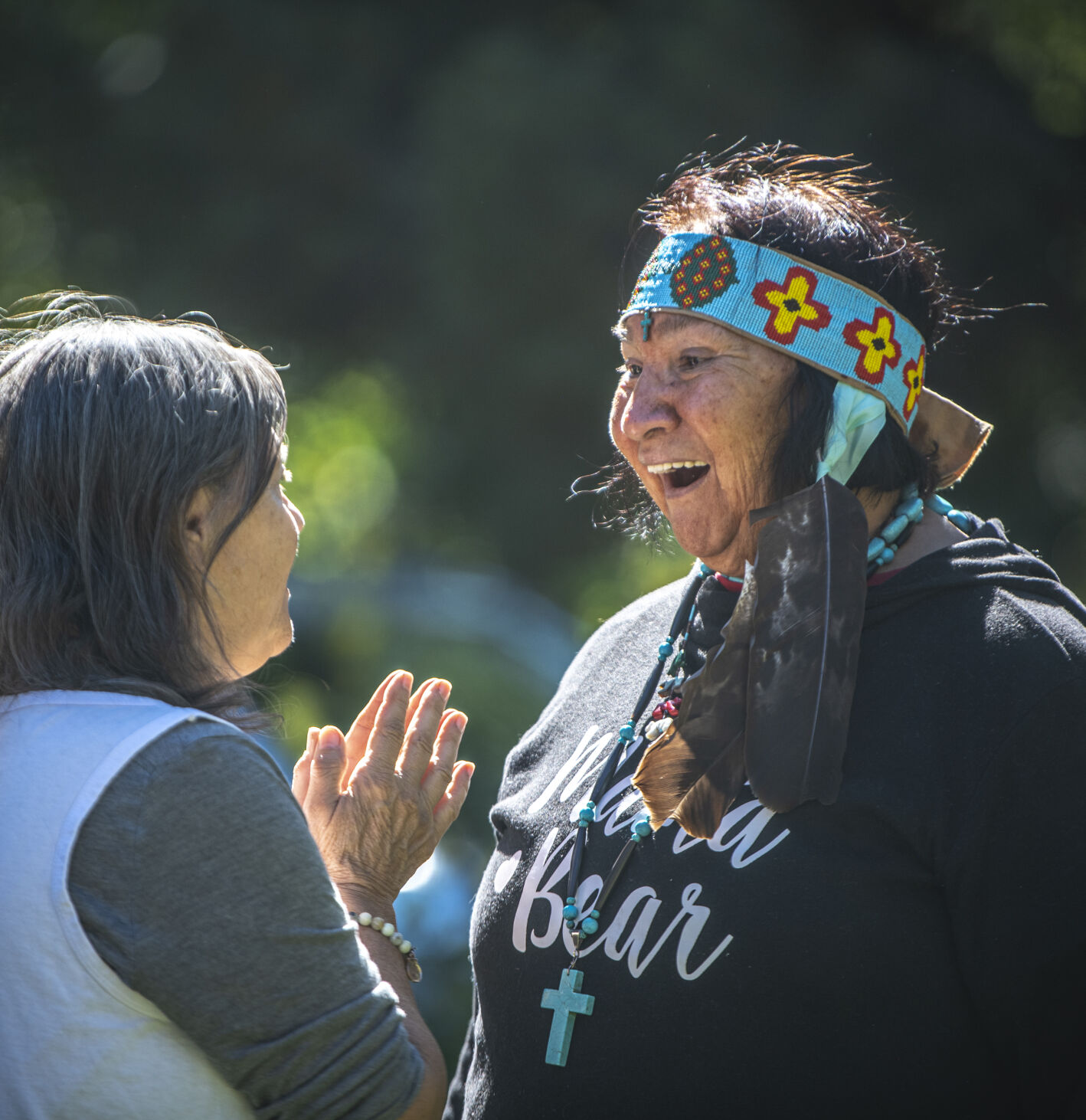 Mama Bear of the Nakawe smiles in conversation with a local before the ‘Planting of the Peace Tree Ceremony,’ at Mansions Park in Manitou Springs, Colo. on Sunday, October 8, 2023. Mama Bear went around to the attendees before the ceremony smudging them and the cottonwood to be planted with burning sage. (Gabi Broekema, The Gazette) (Gabi Broekema)
