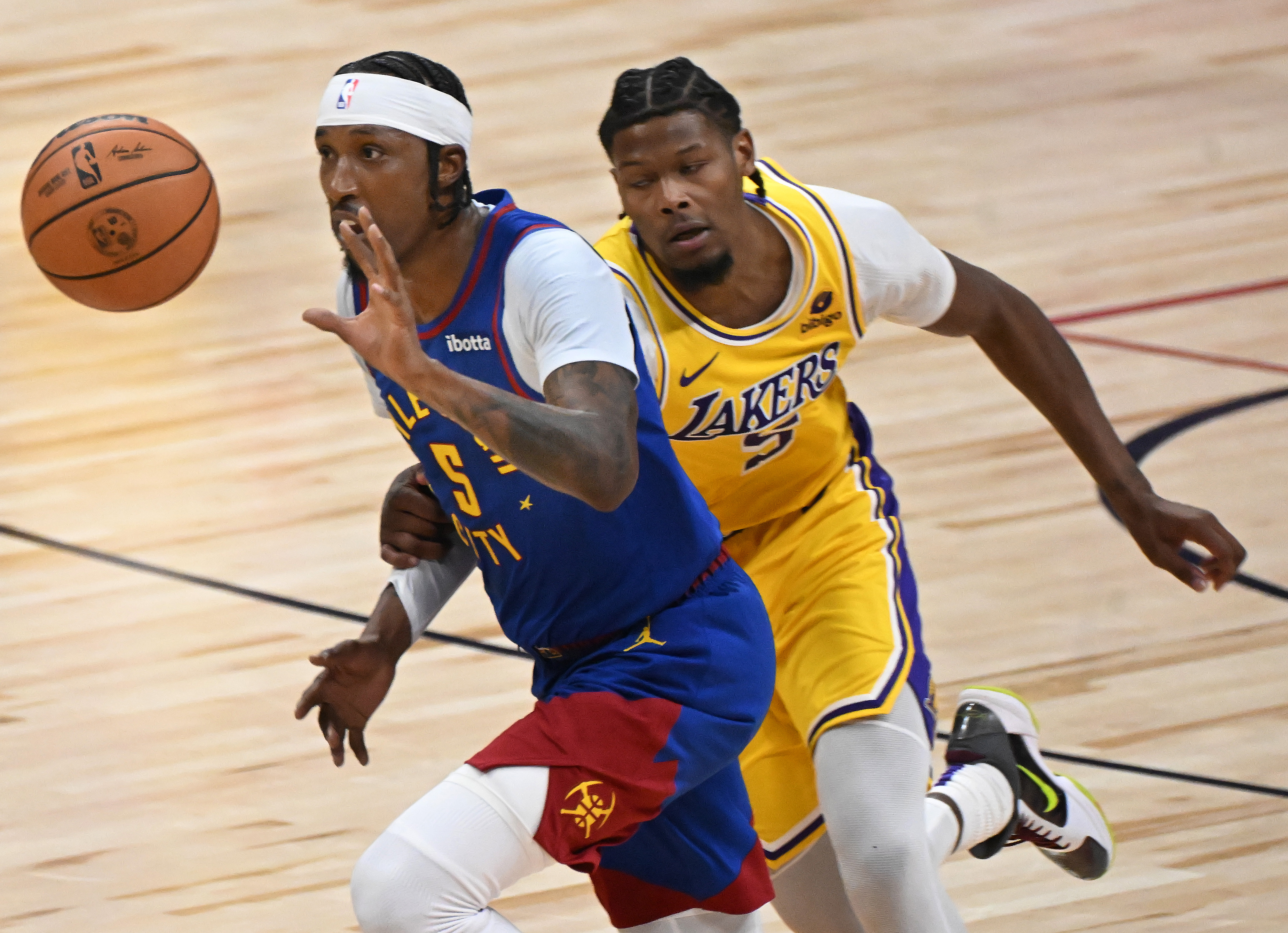 Nuggets Kentavious Caldwell-Pope steals the ball from Lakers Cam Reddish during the second half of a game against the Lakers. The Nuggets defeated the Laker 119-107 at Ball Arena on Tuesday, Oct. 24, 2023. (Photo by Jerilee Bennett, The Gazette)