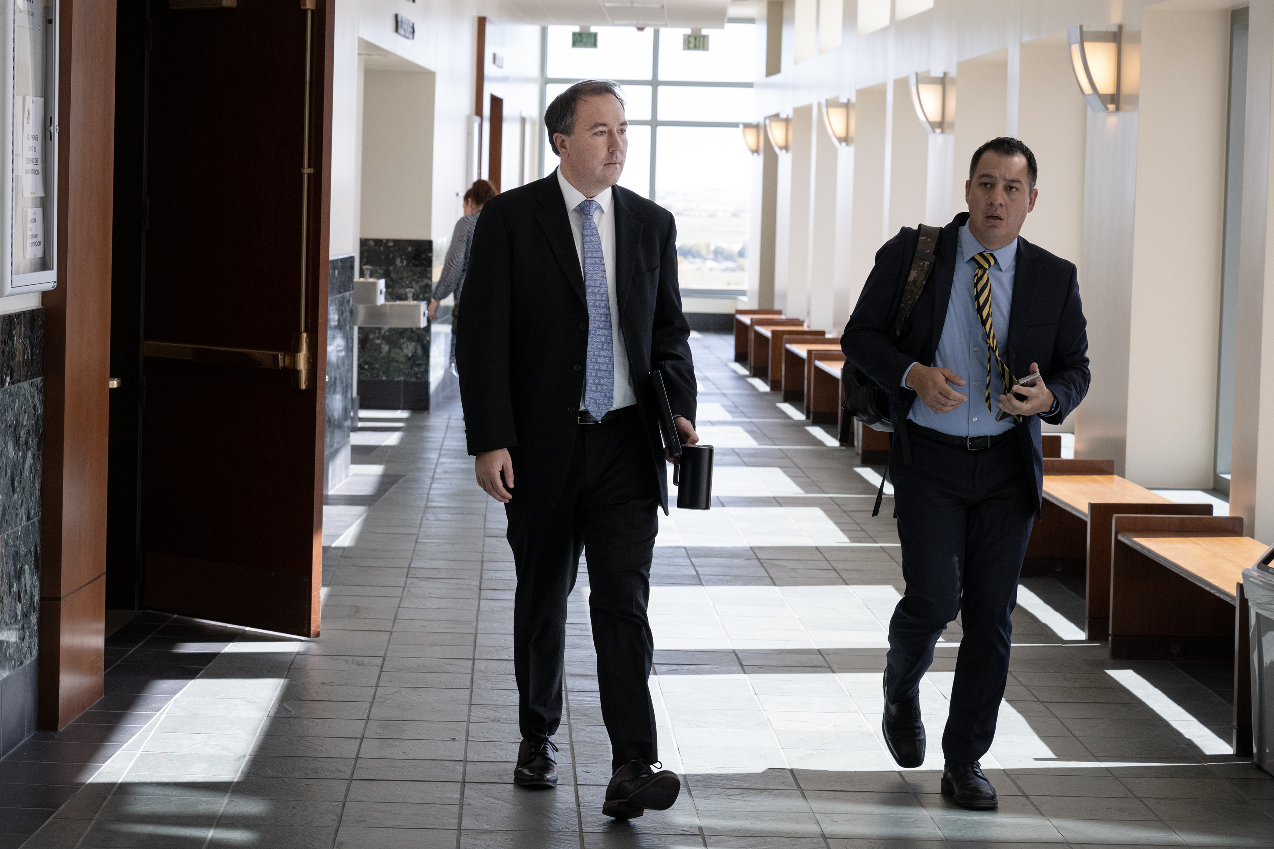 Senior Assistant Attorney General Jason Slothouber, left, exits the courtroom during a break in the trial of Aurora officer Nathan Woodyard on charges he faces in the 2019 death of Elijah McClain, on Wednesday, Oct. 18, 2023, at the Adams County Justice Center in Brighton, Colo. (Timothy Hurst/Denver Gazette) (TimHursttim.hurst@gazette.comhttps://secure.gravatar.com/avatar/aca82bd62b4ee425c598527cd6faa1b1?d=mm&r=g)