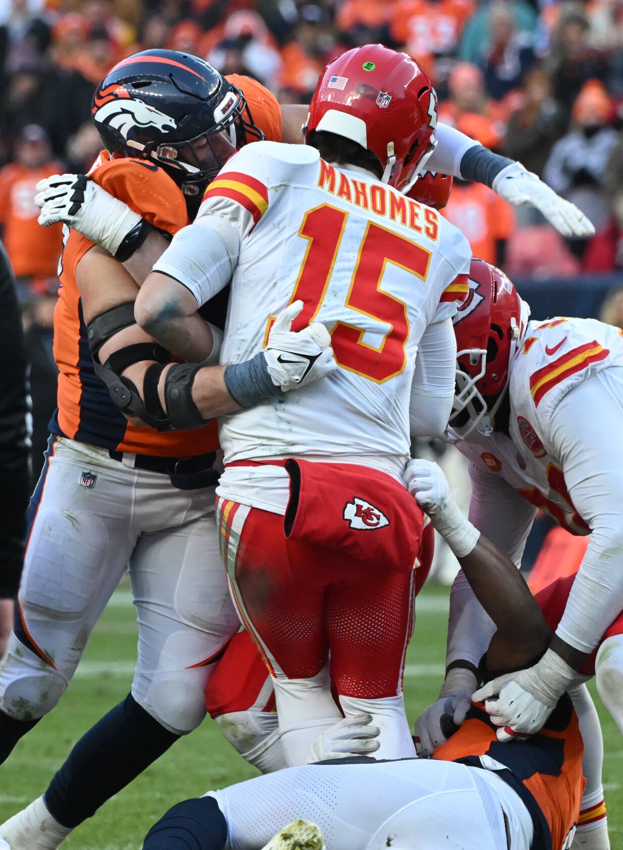 Denver Broncos defensive end Zach Allen (99) sacks Kansas City Chiefs quarterback Patrick Mahomes (15) in the 4th quarter of a game at Empower Field at Mile High on Sunday, Oct. 29, 2023. (Photo by Jerilee Bennett, The Gazette)