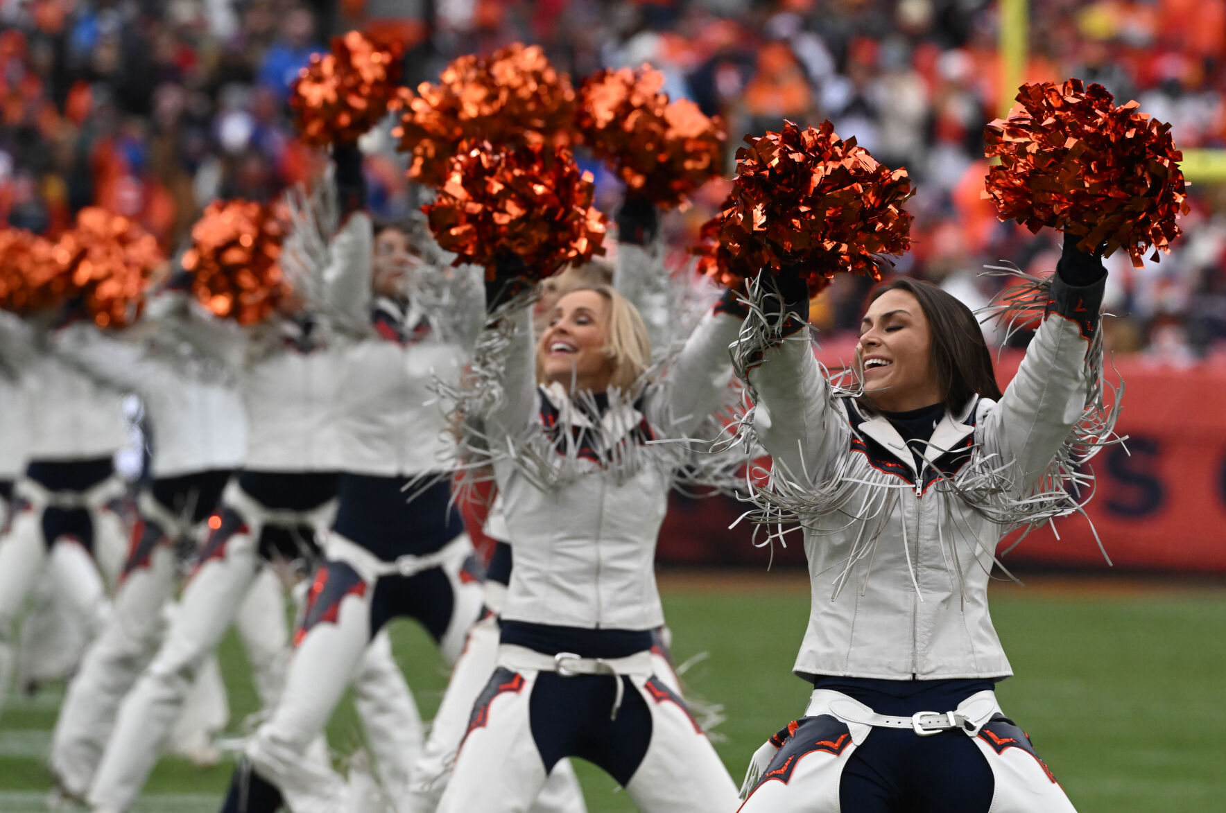 Happy cheerleaders during a game at Empower Field at Mile High on Sunday, Oct. 29, 2023. The Broncos won the game 24-9. (Photo by Jerilee Bennett, The Gazette)