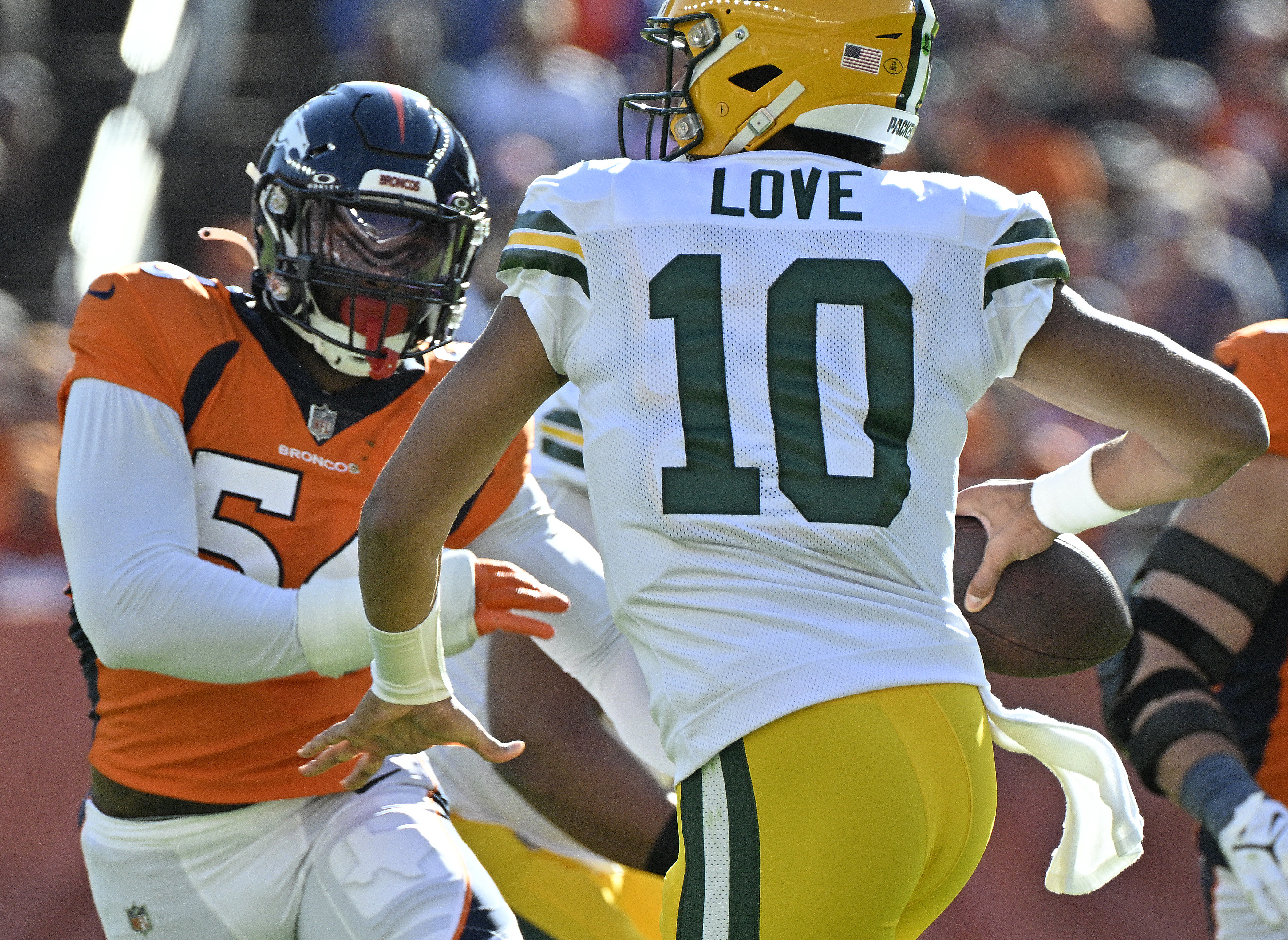 Broncos Baron Browning goes after Packers quarterback Jordan Love during the first half of a game at Empower Field at Mile High on Sunday, Oct. 22, 2023. (Photo by Jerilee Bennett, The Gazette)