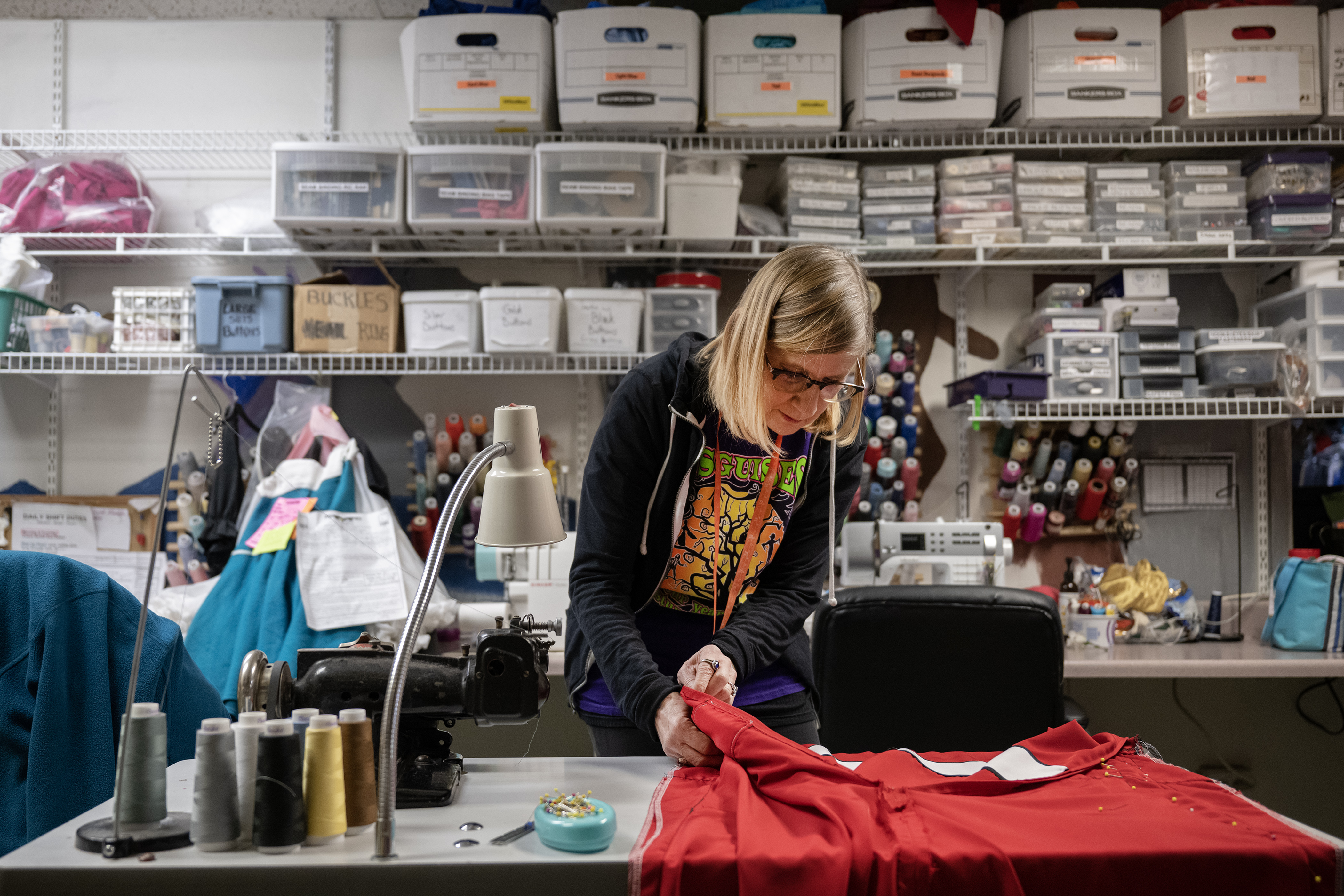 Seamstress Marilyn Bauer-Pitts makes adjustments to a costume for a high school production of Annie at Disguises A Costume Superstore on Friday, Oct. 6, 2023, in Lakewood, Colo. (Timothy Hurst/Denver Gazette) (TimHursttim.hurst@gazette.comhttps://secure.gravatar.com/avatar/aca82bd62b4ee425c598527cd6faa1b1?d=mm&r=g)