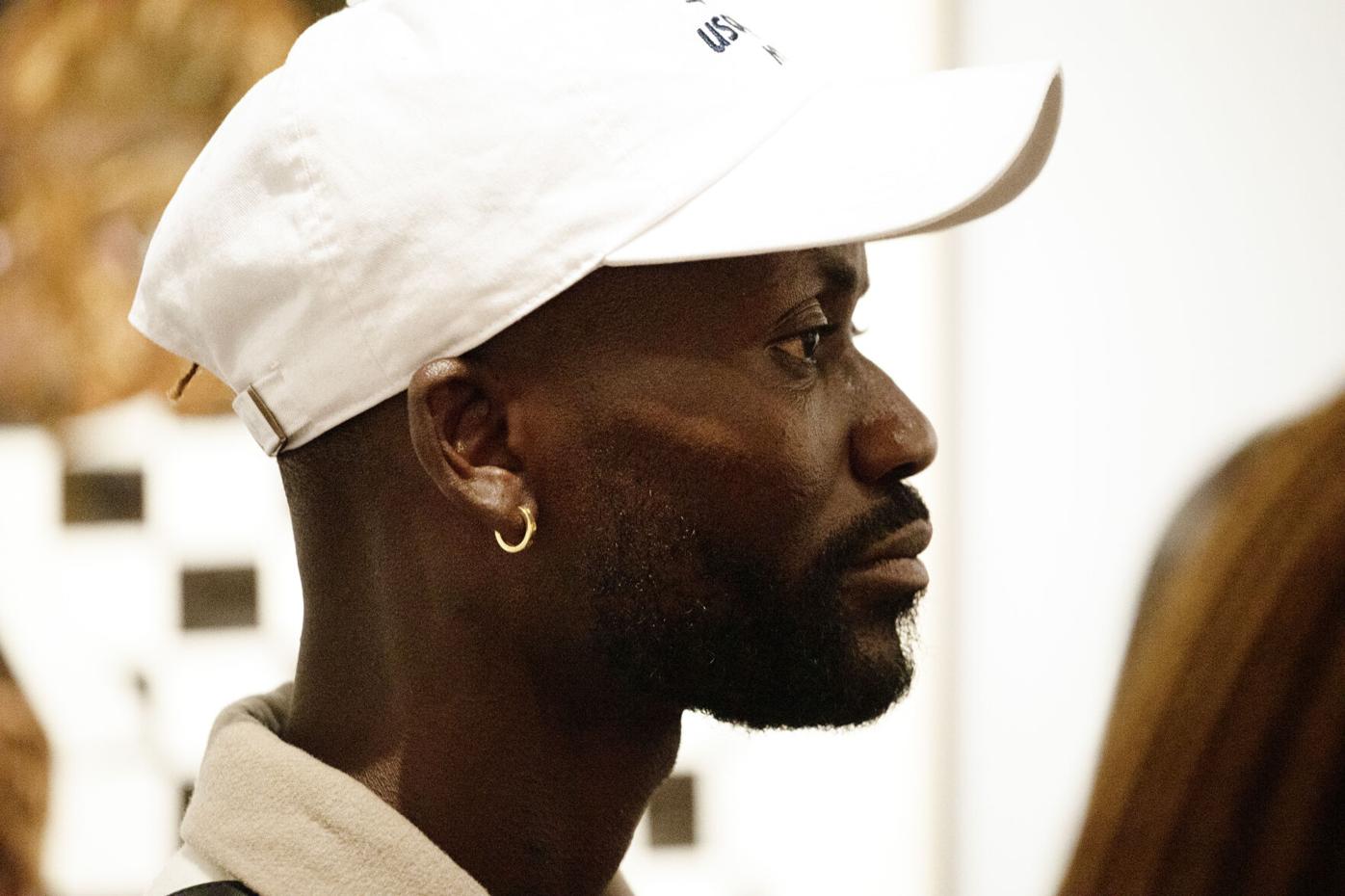 Amoako Boafo listens to Larry Ossei-Mensah speak