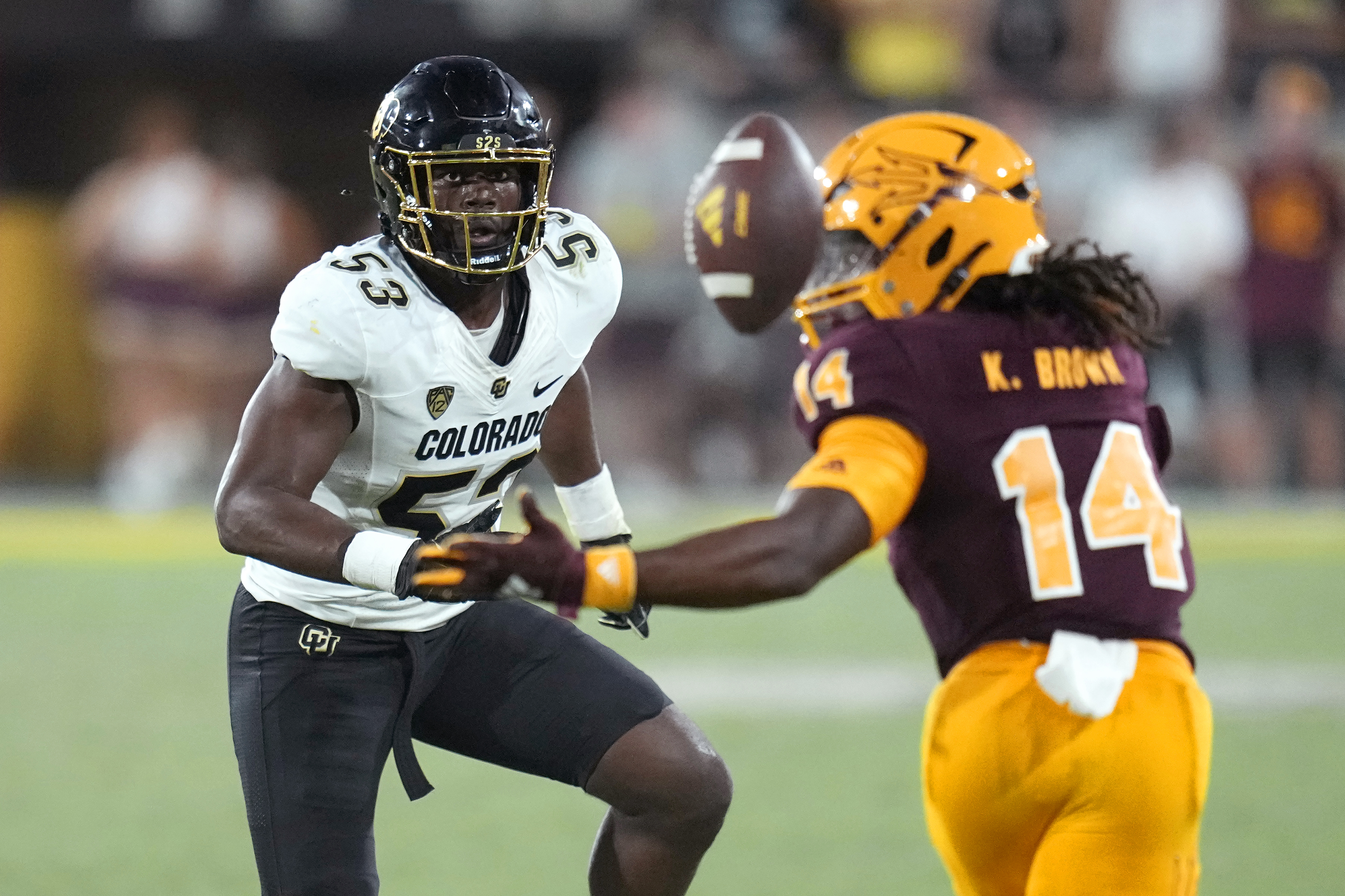 Colorado defensive end Arden Walker (53) closes in as Arizona State running back Kyson Brown (14) is unable to catch a pass during the second half of an NCAA college football game Saturday, Oct. 7, 2023, in Tempe, Ariz. Colorado won 27-24. AP Photo/Ross D. Franklin) (Ross D. Franklin)