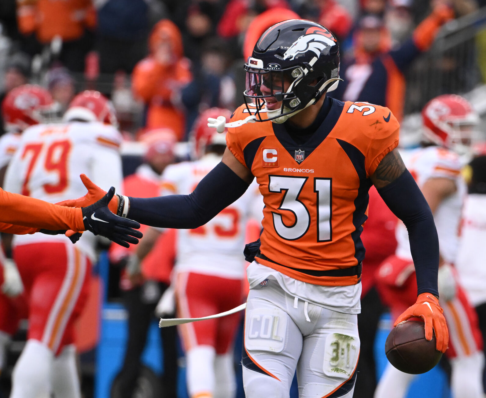 Denver Broncos safety Justin Simmons (31) is congratulated after getting a turnover during a game at Empower Field at Mile High on Sunday, Oct. 29, 2023. The Broncos won the game 24-9. (Photo by Jerilee Bennett, The Gazette)