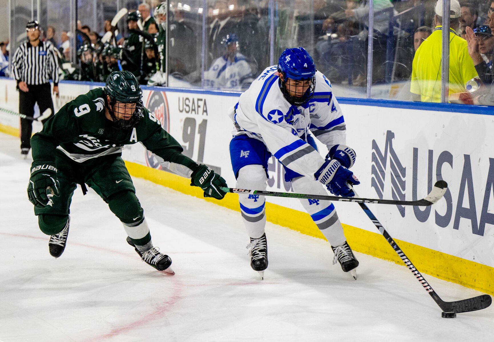 Michigan St. defenseman Matt Basgall (9) hitsAir Force defenseman Luke Rowe (4) with his stick in the third period of a game Thursday, Oct. 12, 2023, at the Cadet Ice Arena on the Air Force Academy in Colorado Springs, Colo. (Parker Seibold, The Gazette) (Parker Seibold)