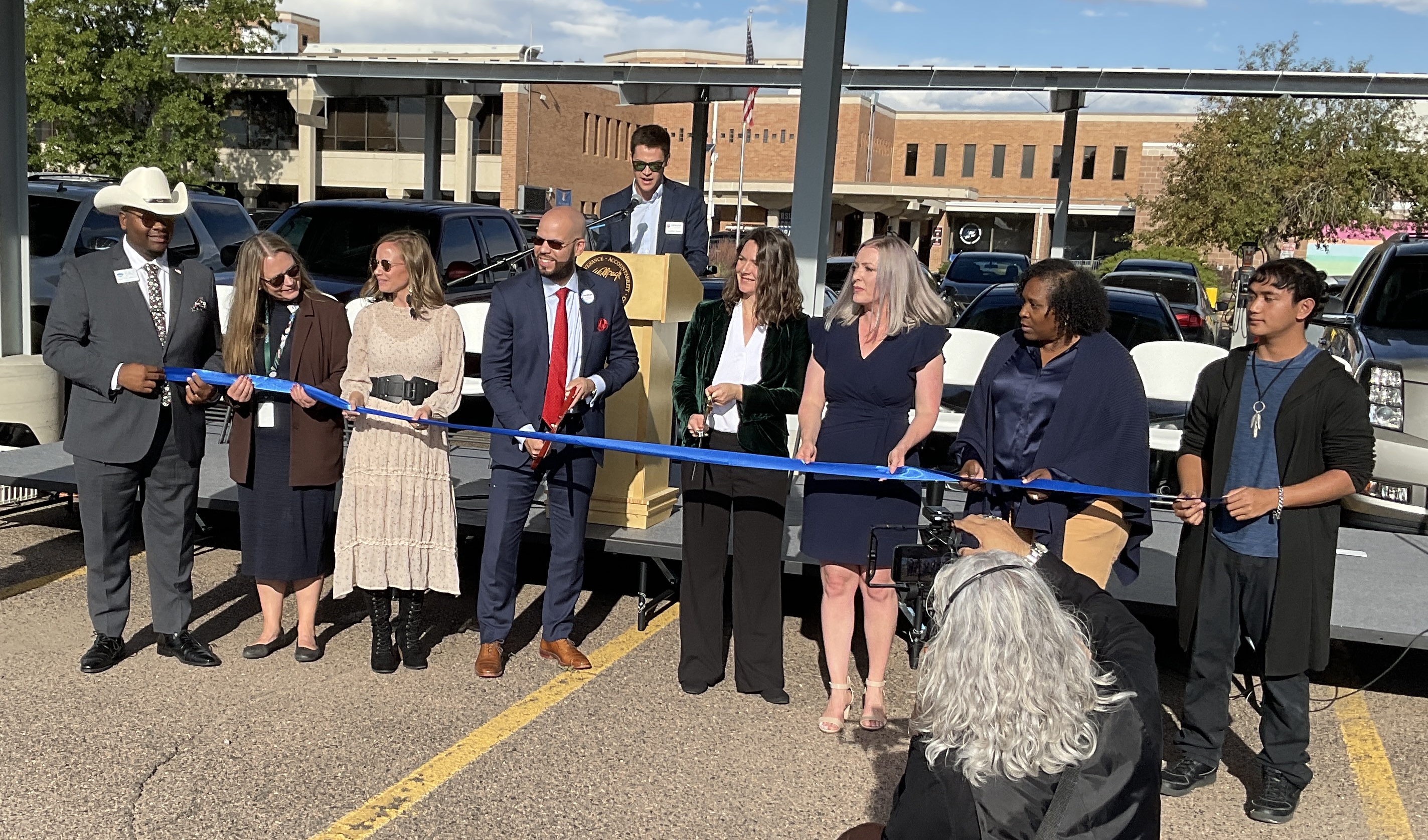 Dignitaries cut a celebratory ribbon at the completion of a $1.5 million solar carport at the Northeast Early College High School in Denver’s Montebello neighborhood on Wednesday, October 11, 2023. Left to right: Auon’tai Anderson, DPS Board of Education director; Carrie Olson, DPS Board of Education director; LeAnn Kittle, Denver Public Schools director of Sustainability; Alex Marrero, Denver Public Schools superintendent; Elizabeth Babcock, Executive Director of Denver’s Office of Climate Action, Sustainability and Resiliency; Jennifer Warren, principal of Northeast Early College High School; Michelle Quattlebaum, DPS Board of Education director; David Laloata, sophomore at Northeast Early College High School (on stage – Jonathan Rogers, Manager of Mobility and Energy Transition with Denver’s Office of Climate Action, Sustainability and Resiliency) (ScottWeiserEnterprise Reporterscott.weiser@gazette.comhttps://secure.gravatar.com/avatar/bedf4ba0a073402c3991ce97ce2869c4?d=mm&r=g)