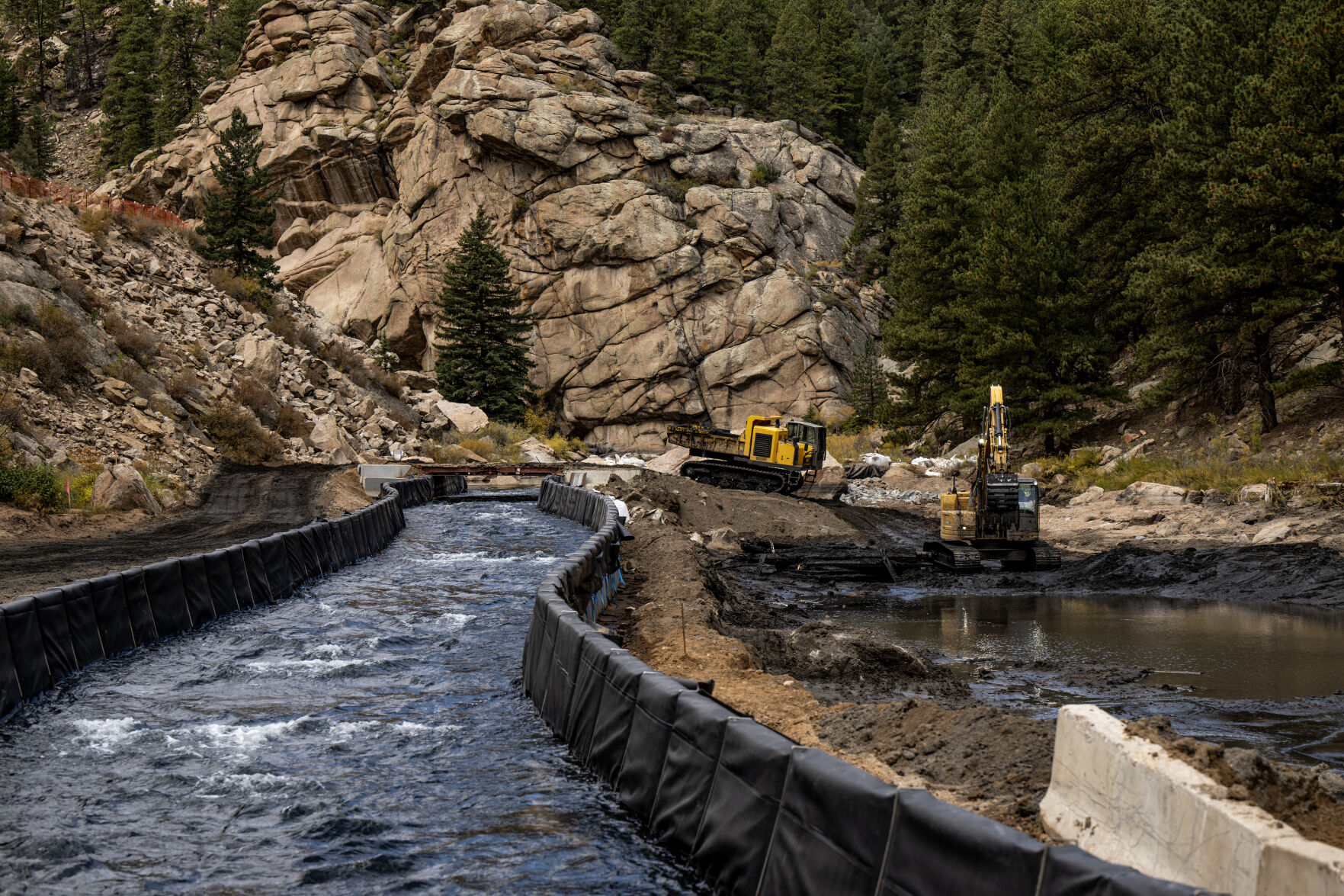 Water flows through a 607-foot-long diversion on the South Platte River on Oct. 4, 2023. Crews had to divert water so they could take down the Lake George Dam one half at a time, and remove 17,000 cubic yards of sediment that had built up over the last 70 years. (Parker Seibold, The Gazette) (Parker Seibold, the gazette)