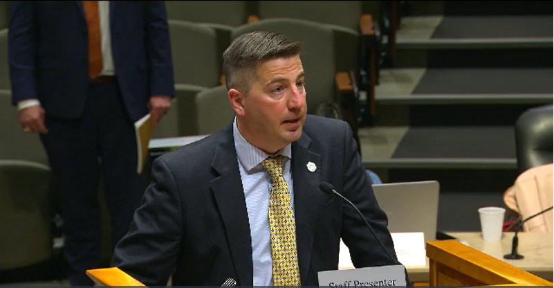 FILE PHOTO: Aurora's deputy city manager, Jason Batchelor, gives a presentation to City Council on Nov. 22, 2021 about a consent decree reached with the attorney general's office for systemic changes to the city's police and fire departments. He's been named the permanent city manager. (via AuroraTV)