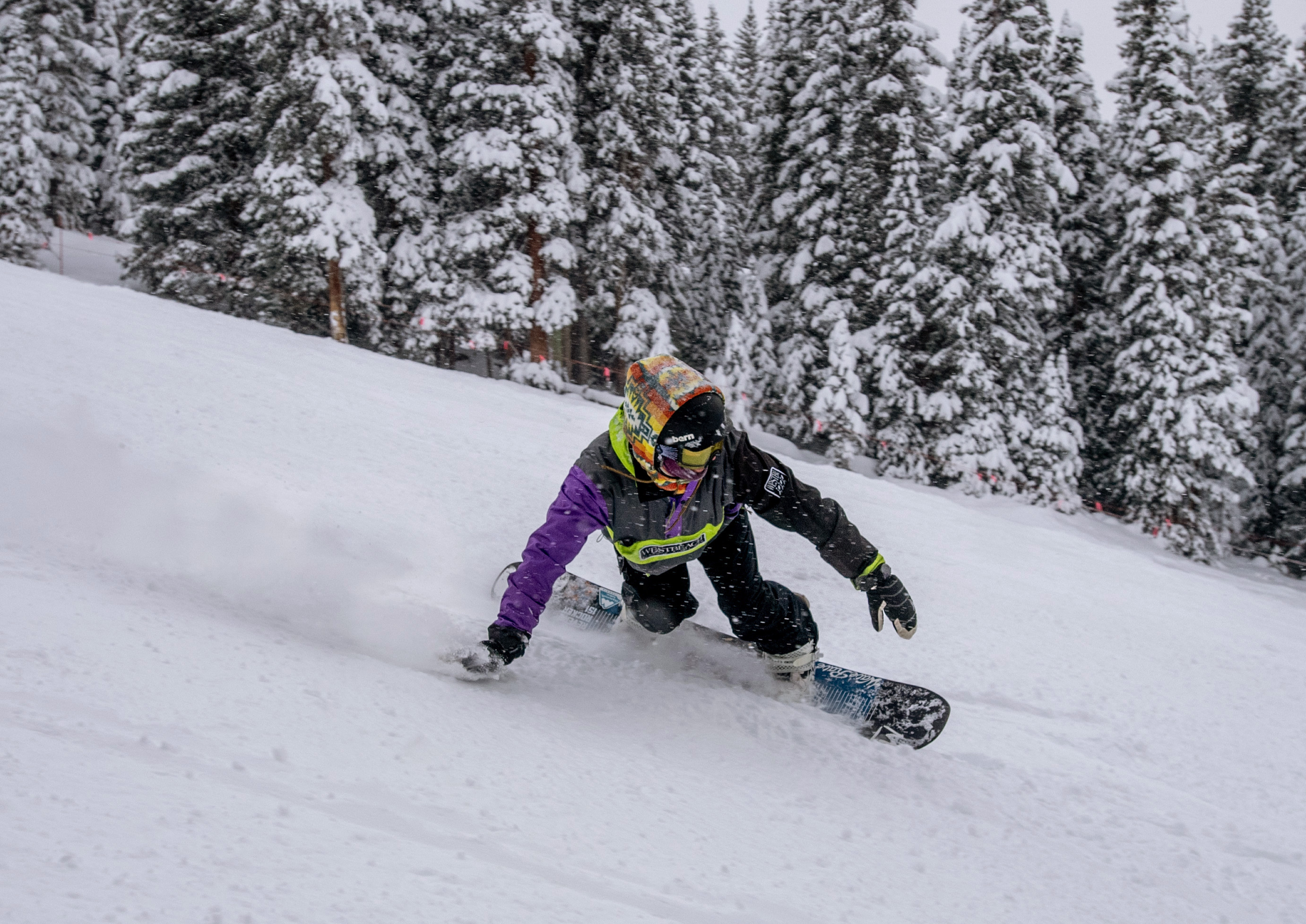 A snowboarder runs their hand through fresh powder during opening day at Arapahoe Basin on Sunday, Oct. 29, 2023. (Parker Seibold, The Gazette) (Parker Seibold)