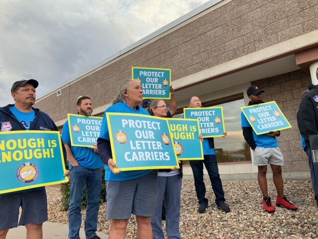 Local mail carriers attend a rally asking for the United States Postal Service to increase safety measure. The mail carriers said they are increasingly the targets of robberies and physical assaults as they deliver the mail to residents and businesses. (Cole Sullivan, 9News)