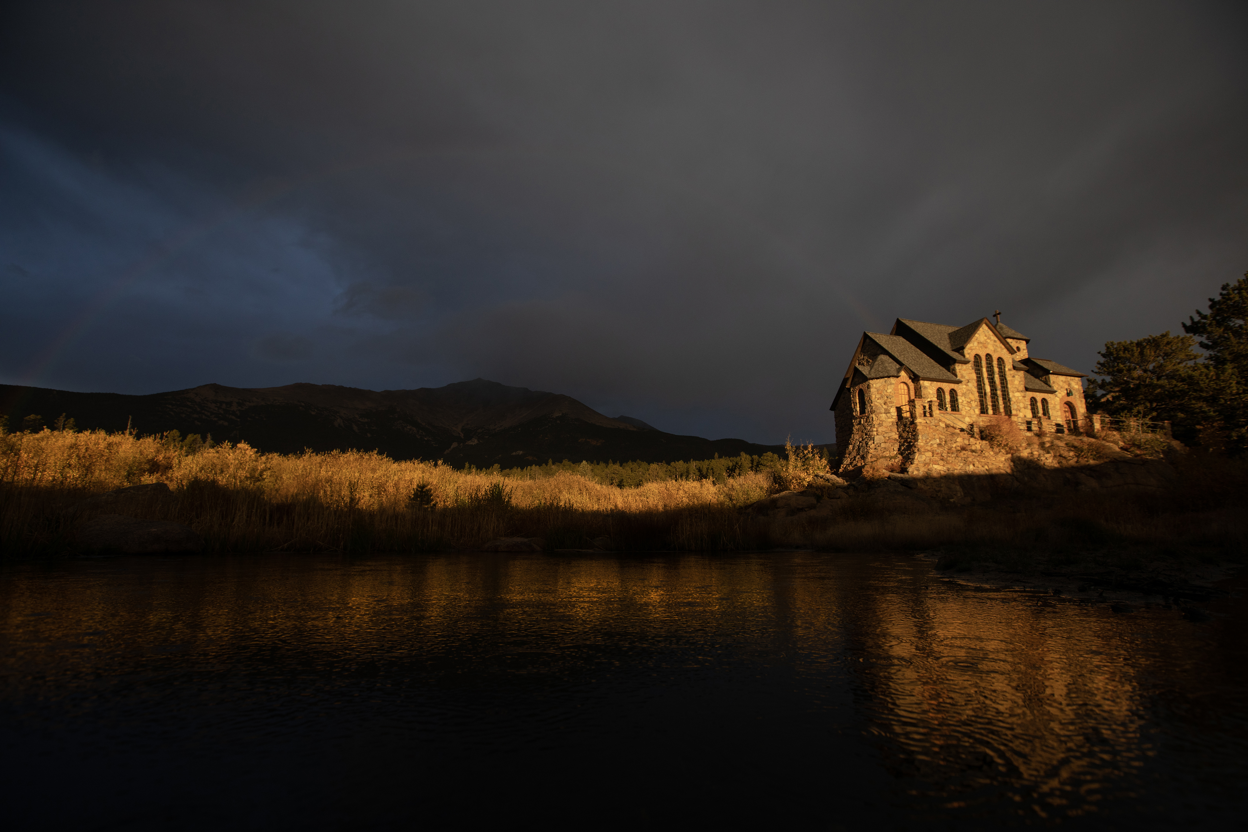 Stromclouds build over a snowcapped Mount Meeker as Saint Catherine's Chapel on the Rock is illuminated by the early morning sun on Monday, Oct. 2, 2023, in Allenspark, Colo. (Timothy Hurst/Denver Gazette) (TimHursttim.hurst@gazette.comhttps://secure.gravatar.com/avatar/aca82bd62b4ee425c598527cd6faa1b1?d=mm&r=g)