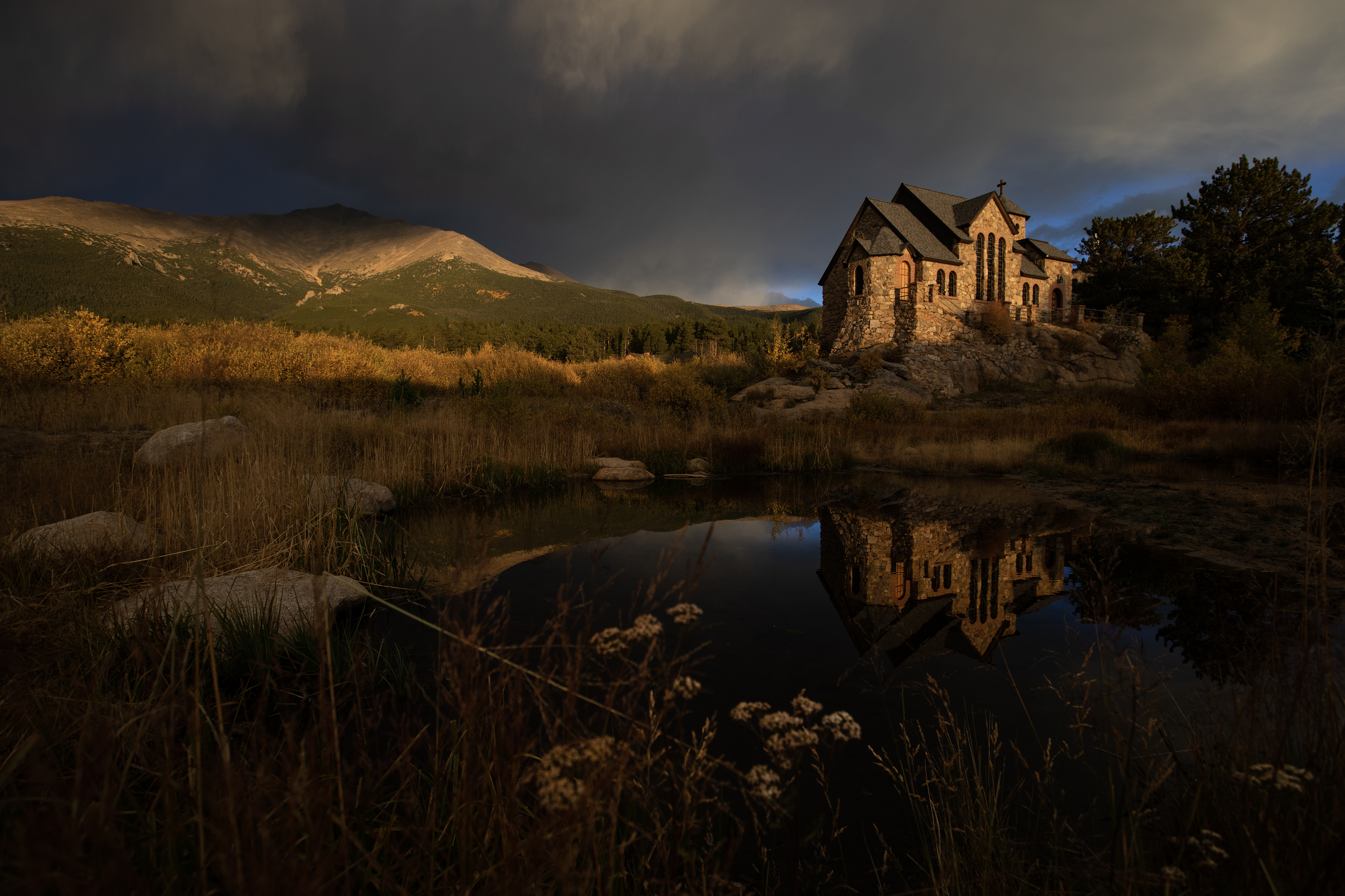 Stromclouds build over a snowcapped Mount Meeker as Saint Catherine's Chapel on the Rock is illuminated by the early morning sun on Monday, Oct. 2, 2023, in Allenspark, Colo. (Timothy Hurst/Denver Gazette) (TimHursttim.hurst@gazette.comhttps://secure.gravatar.com/avatar/aca82bd62b4ee425c598527cd6faa1b1?d=mm&r=g)