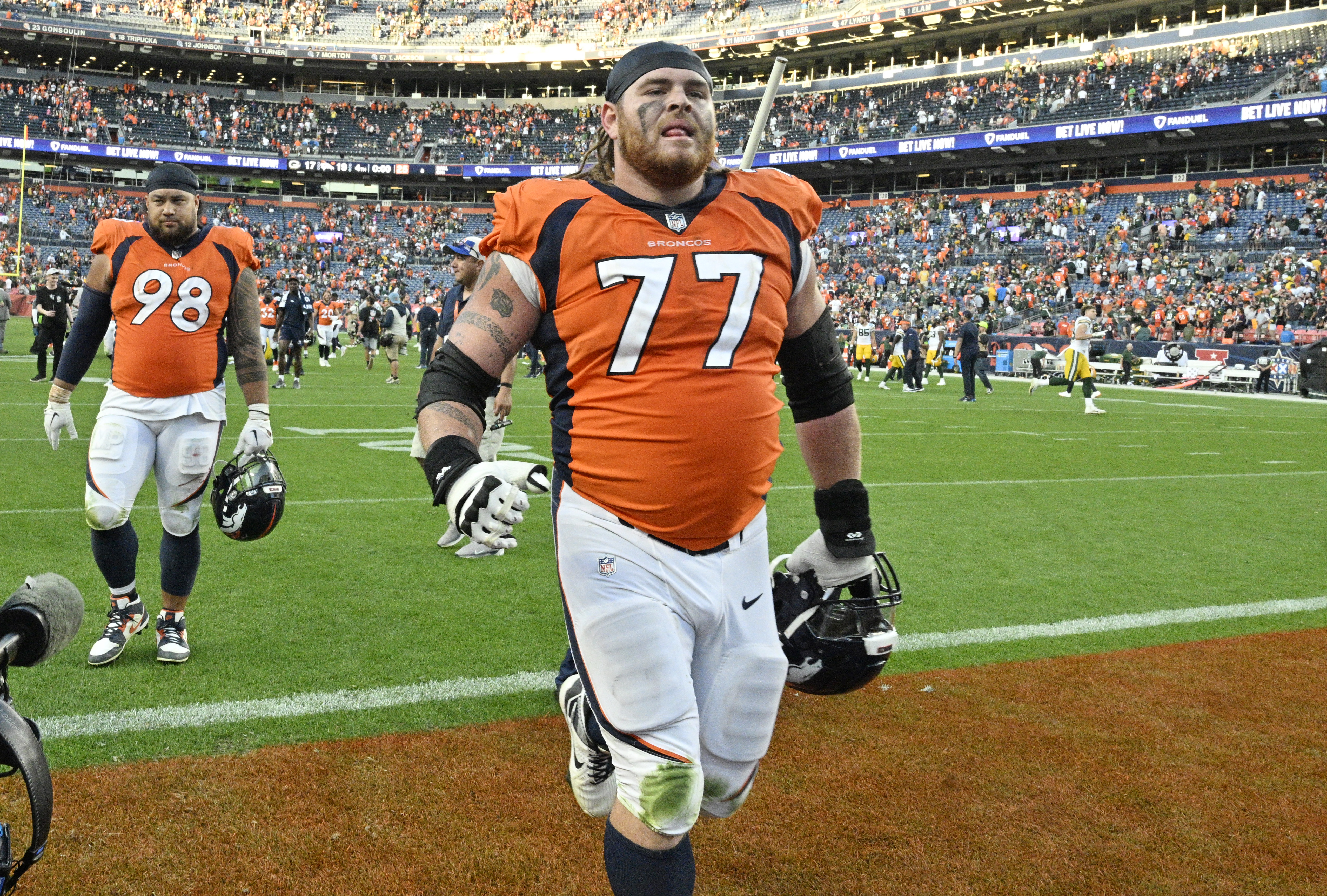 Denver Broncos guard Quinn Meinerz (77) leaves the field after a Broncos win against the Packers at Empower Field at Mile High on Sunday, Oct. 22, 2023. (Photo by Jerilee Bennett, The Gazette)