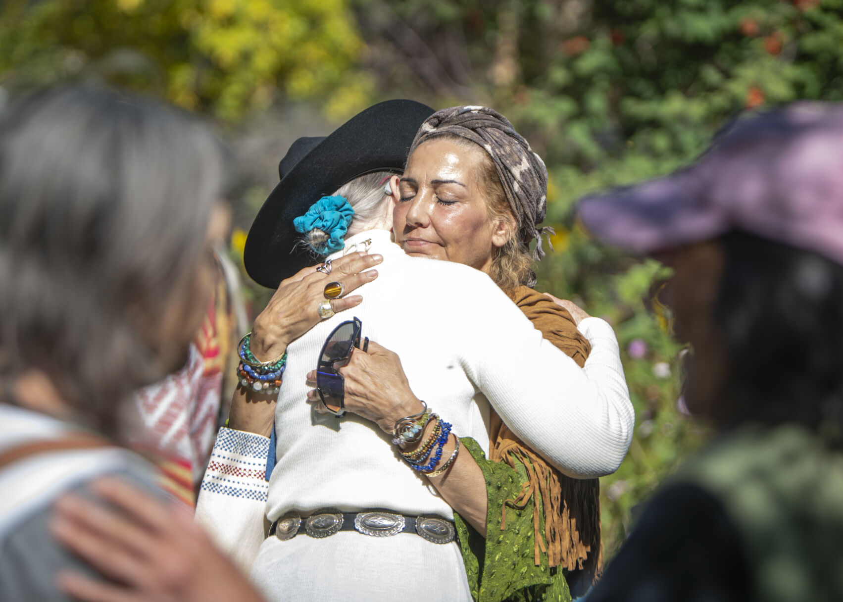 Attendees of the ‘Planting of the Peace Tree,’ ceremony embrace at Mansions Park in Manitou Springs, Colo. on Sunday, Oct. 8, 2023. (Gabi Broekema, The Gazette) (Gabi Broekema)