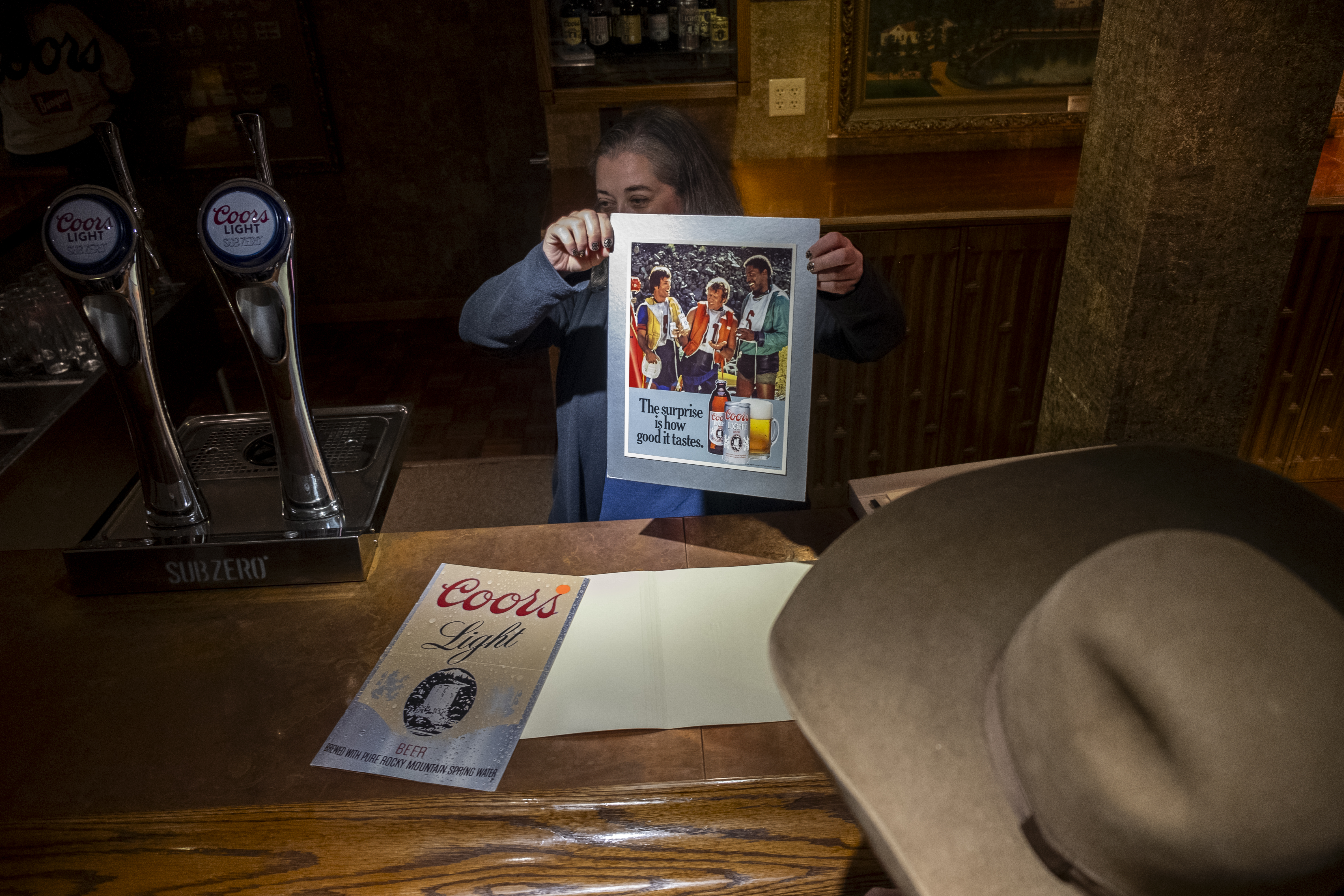 Molson Coors archivist Heidi Harris displays a Coors Light advertisement to a group after a tour of the Coors Brewery led by Peter J. Coors Tuesday, Sept. 26, 2023 in Golden, Colorado. (JonathanIngrahamDigital Strategistjonathan.ingraham@denvergazette.comhttps://denvergazette.com/content/tncms/avatars/c/dd/7f0/cdd7f086-b693-11ec-b373-bba598953eb6.fc0f5608a6f1144f64f080f771bd904d.png)