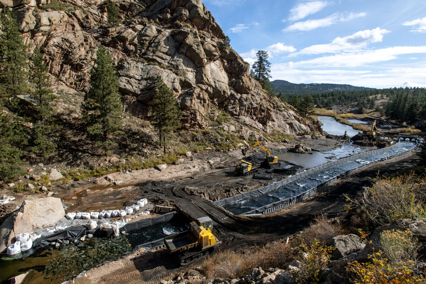 Crews work on the deconstruction of the Lake George Dam at the mouth of Eleven Mile Canyon Recreation Area on Oct. 4, 2023. The dam was built in the 1950s and was used by Colorado Springs Utilities as a temporary diversion through the 1960s during the construction of the Blue River pipeline. (Parker Seibold, The Gazette) (Parker Seibold. the gazette)