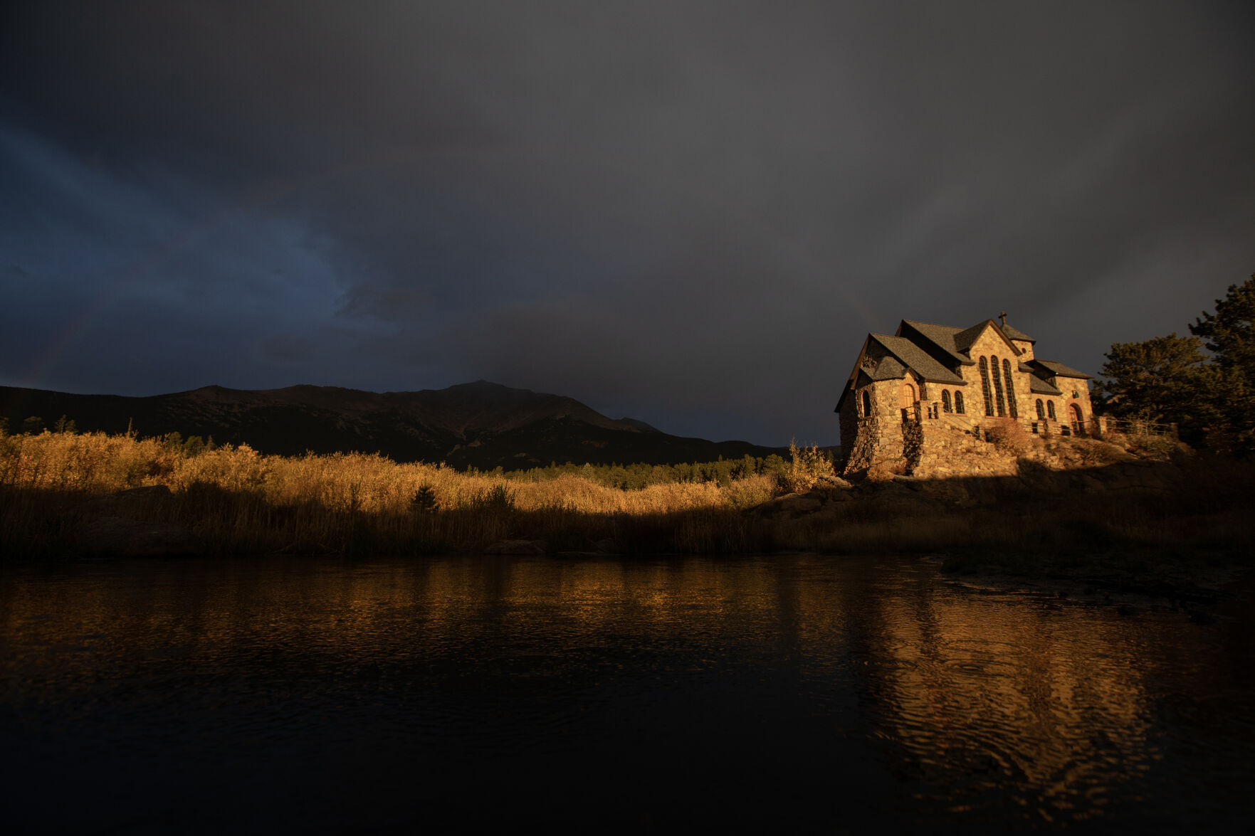 Stromclouds build over a snowcapped Mount Meeker as Saint Catherine's Chapel on the Rock is illuminated by the early morning sun on Monday, Oct. 2, 2023, in Allenspark, Colo. (Timothy Hurst/Denver Gazette) (TimHursttim.hurst@gazette.comhttps://secure.gravatar.com/avatar/aca82bd62b4ee425c598527cd6faa1b1?d=mm&r=g)