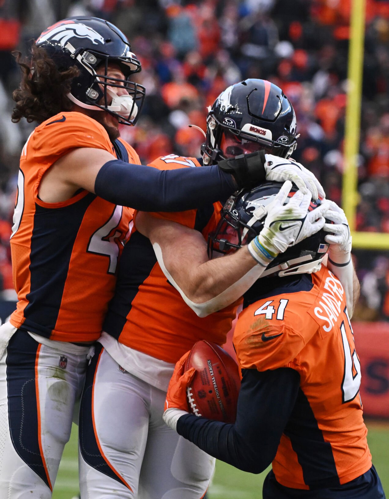 Denver Broncos linebacker Drew Sanders (41) celebrates with teammates Denver Broncos linebacker Alex Singleton (49) and Denver Broncos linebacker Josey Jewell (47) after scooping up a muffed punt fumble by the Chiefs in the 4th quarter of a game at Empower Field at Mile High on Sunday, Oct. 29, 2023. (Photo by Jerilee Bennett, The Gazette)
