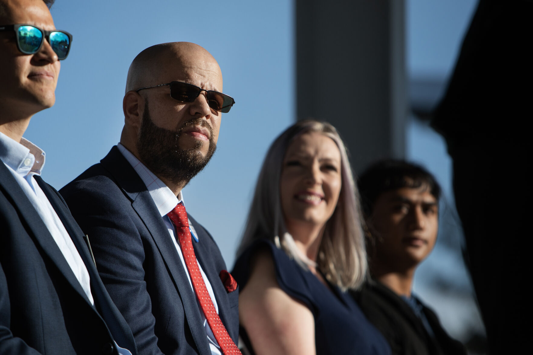 Denver Public Schools superintendent Dr. Alex Marrero looks on as executive director of Denver’s Office of Climate Action, Sustainability and Resiliency, Elizabeth Babcock, speaks during an event to unveil a new solar carport in the parking lot of Northeast Early College High School on Oct. 11 in Denver. (TimHursttim.hurst@gazette.comhttps://secure.gravatar.com/avatar/aca82bd62b4ee425c598527cd6faa1b1?d=mm&r=g)