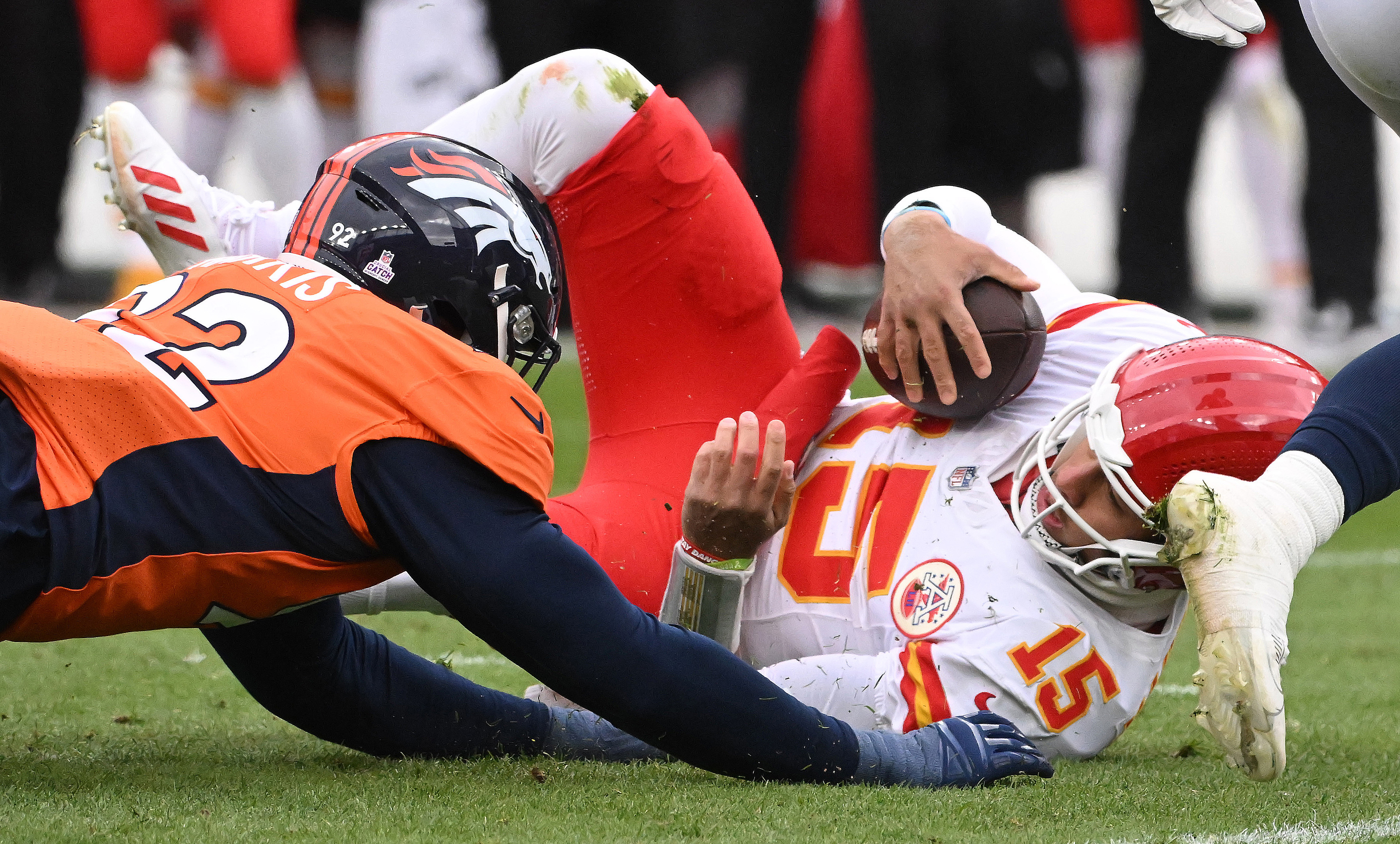 Kansas City Chiefs quarterback Patrick Mahomes (15) is brought down by Denver Broncos defensive tackle Jonathan Harris (92) during a game at Empower Field at Mile High on Sunday, Oct. 28, 2023. The Broncos defeated the Chiefs 24-9. (Photo by Jerilee Bennett, The Gazette).
