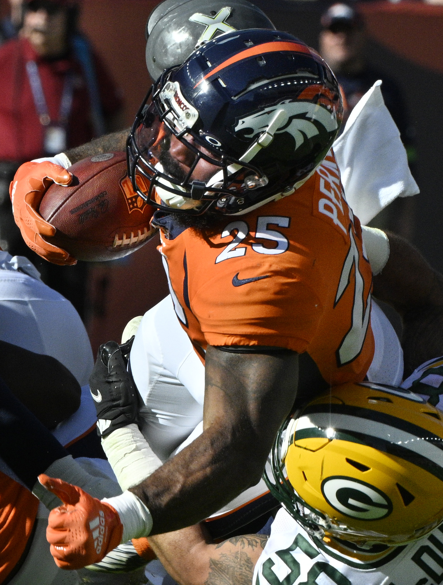 Denver Broncos running back Samaje Perine (25) carries the ball during a game at Empower Field at Mile High on Sunday, Oct. 22, 2023. (Photo by Jerilee Bennett, The Gazette)